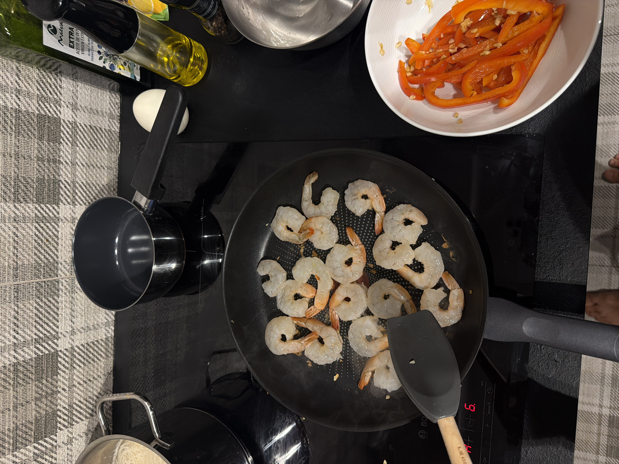Shrimp hitting the pan on a Warsaw induction stovetop