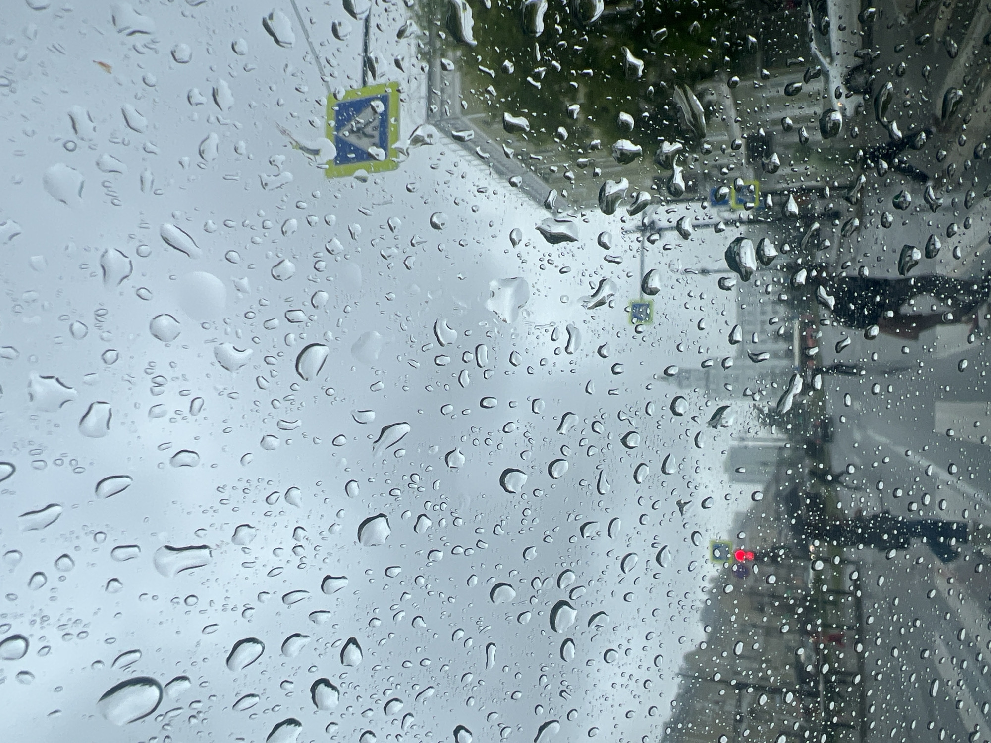 Rainy afternoon captured through car windshields in Perm, Russia