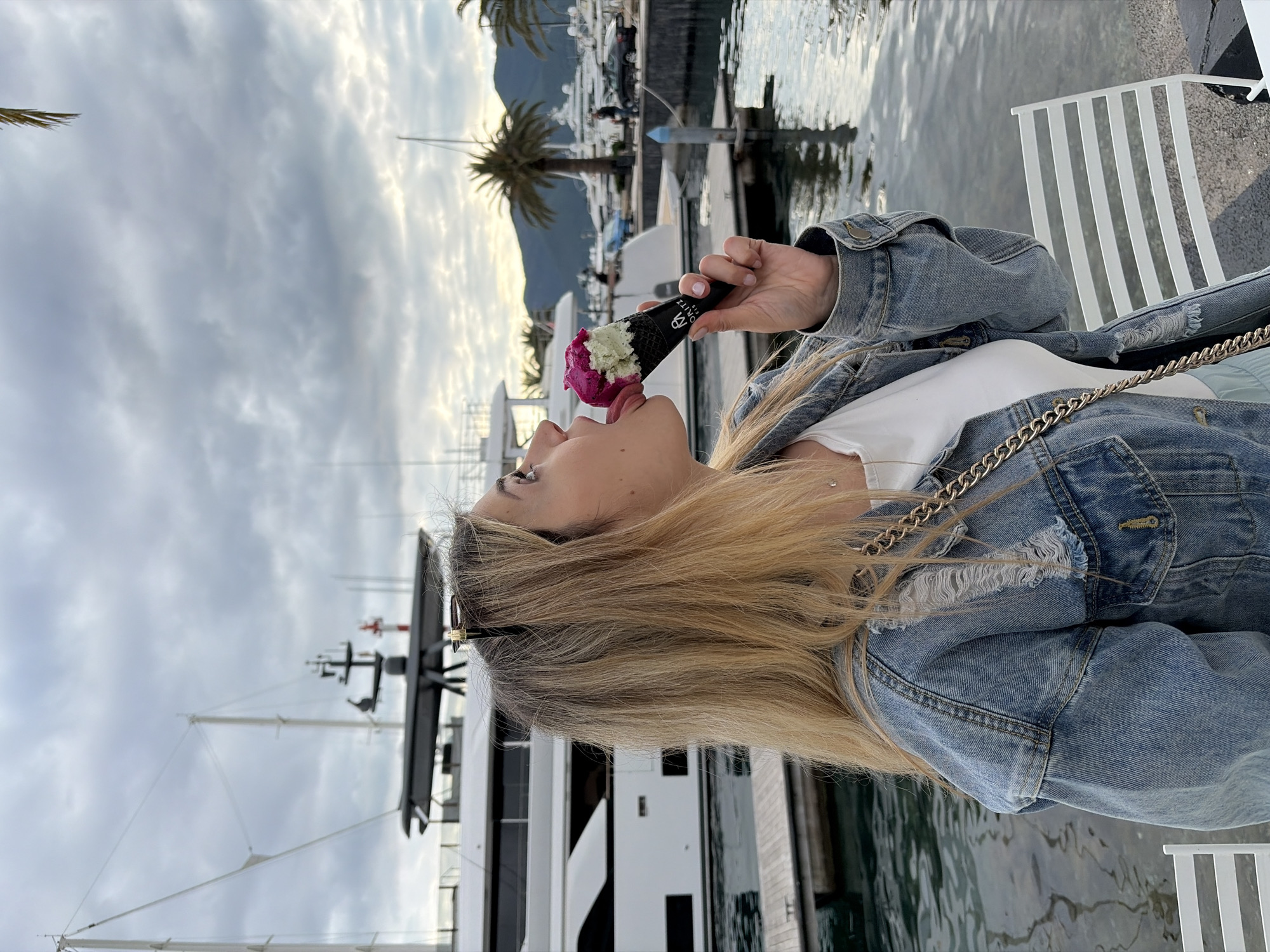 Woman enjoys ice cream tour around Tivat marina Montenegro