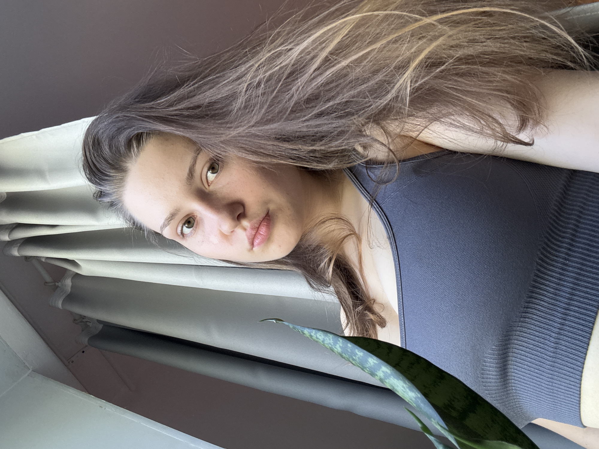 Indoor portrait session captured on purple yoga mat