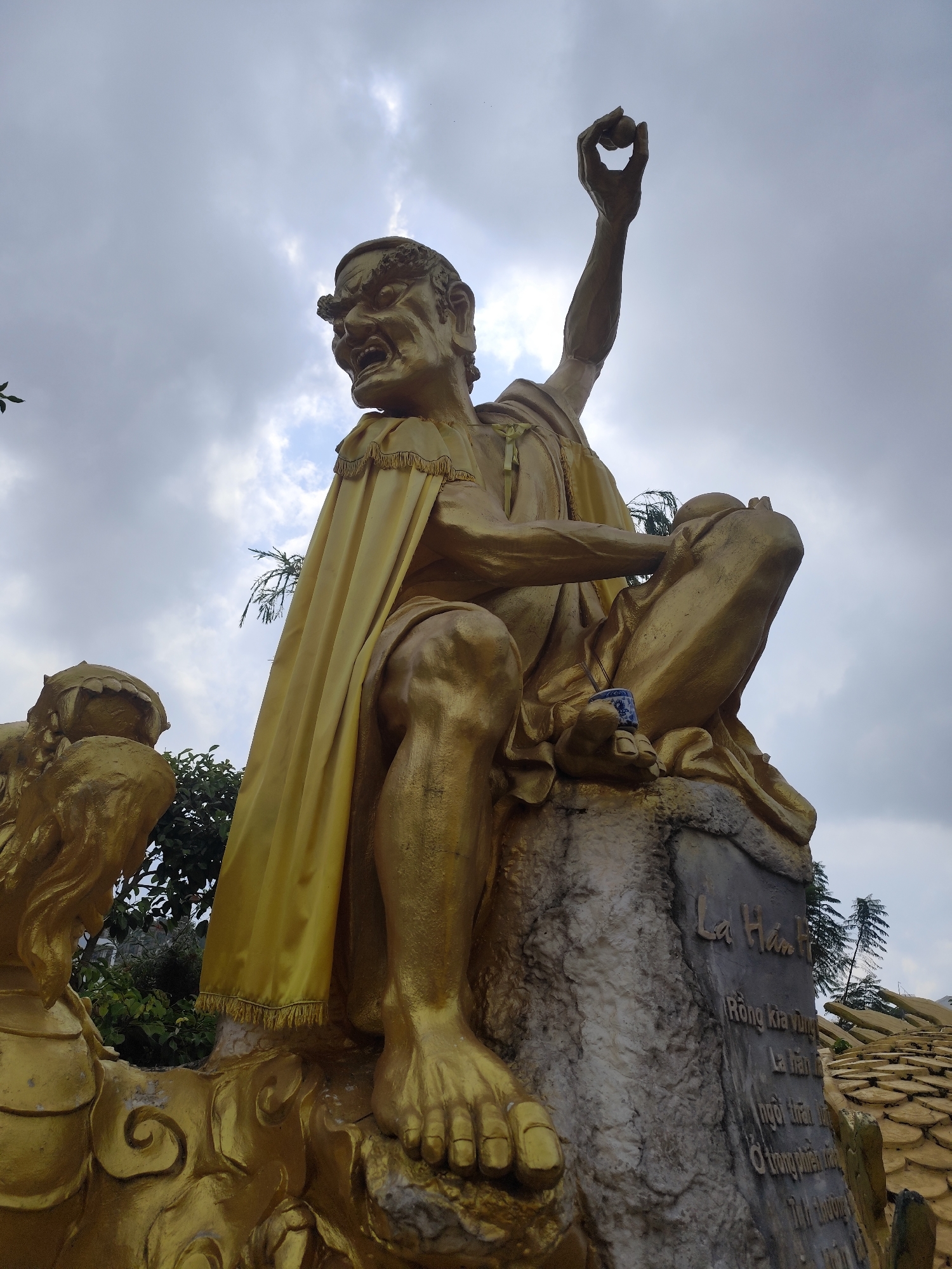 Temple visitors document Linh Phuoc Pagoda statuary in Vietnam