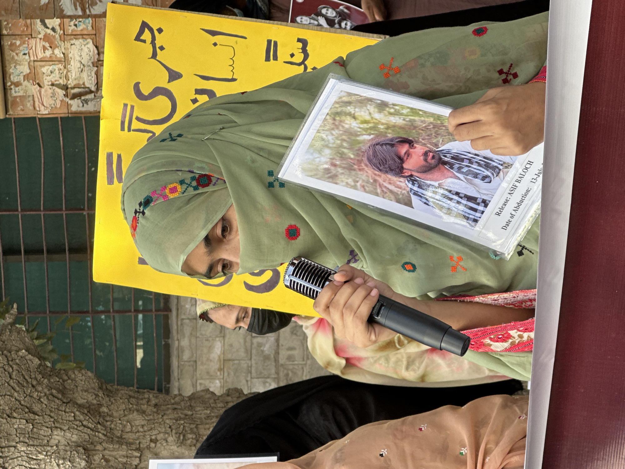 Protest in Quetta with speakers holding photographs of missing persons