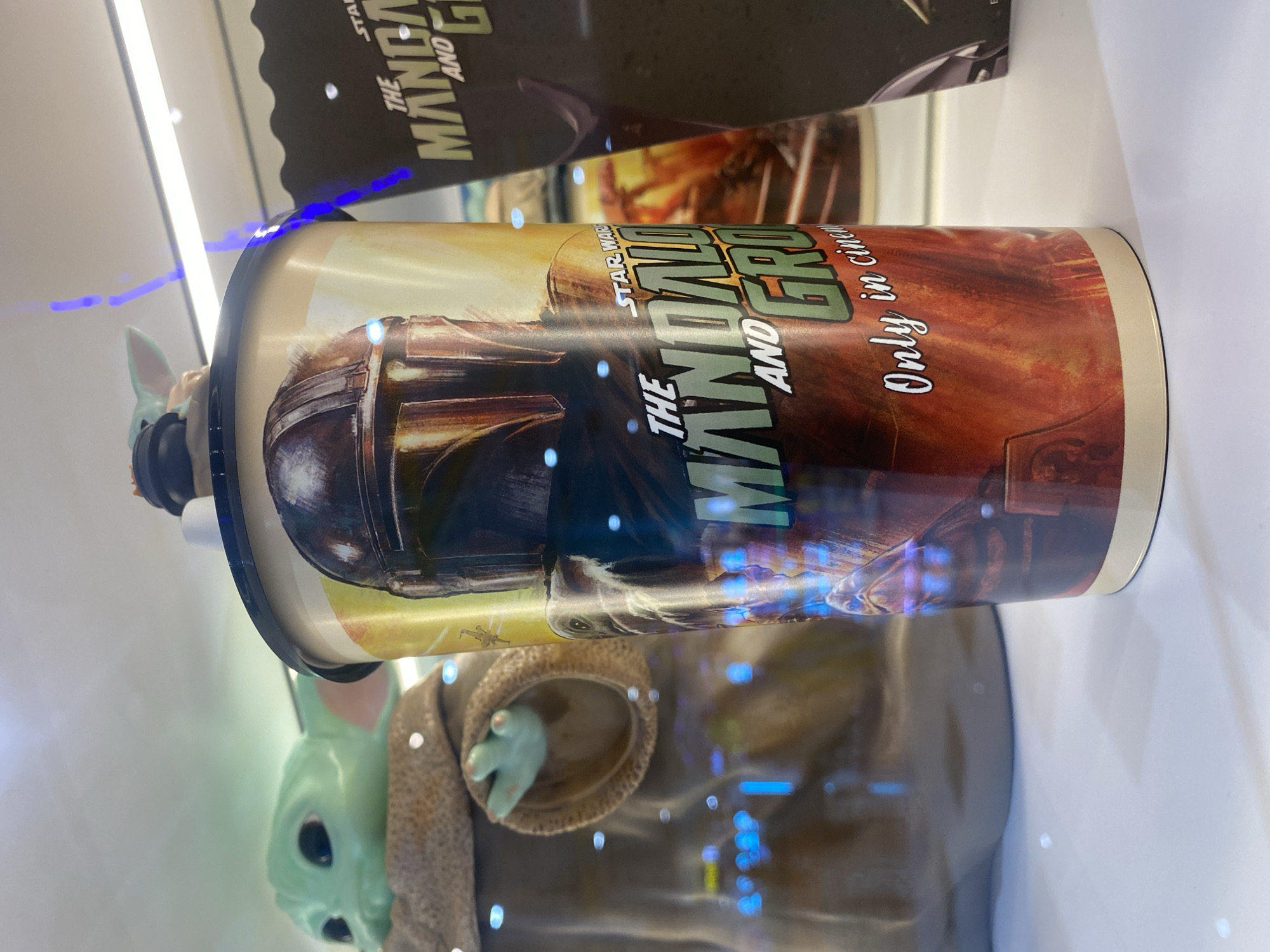 Pop culture merchandise displays documented at Thai entertainment venue