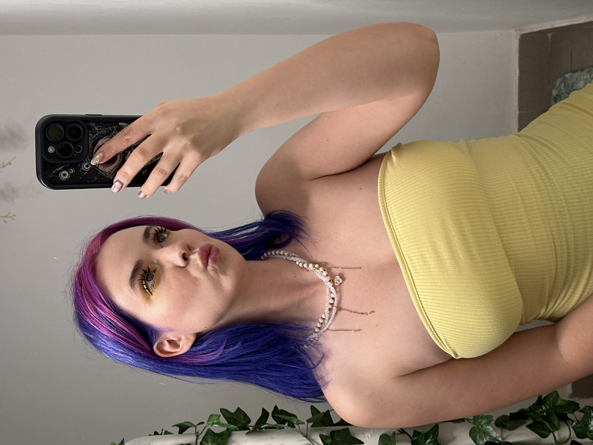 Woman takes multiple selfies in decorated Zagreb interior