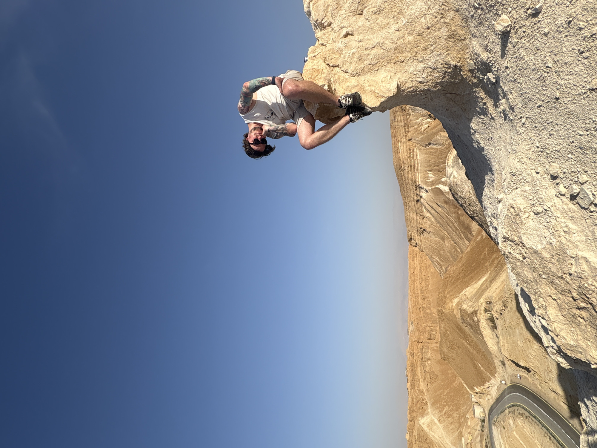 Man hangs upside down from cliff in Arad desert