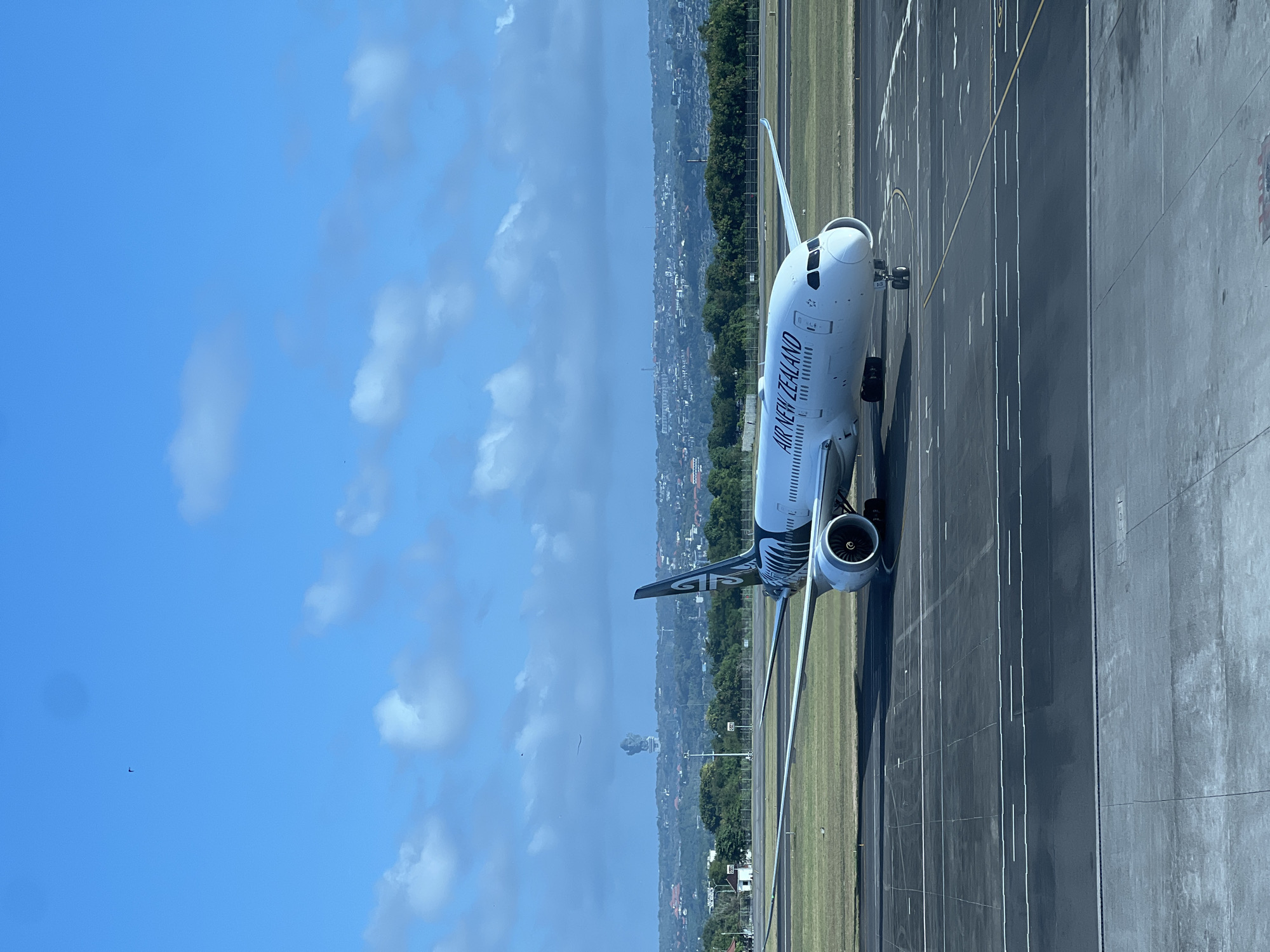Morning activity across Bali's Ngurah Rai Airport — tarmac and terminal