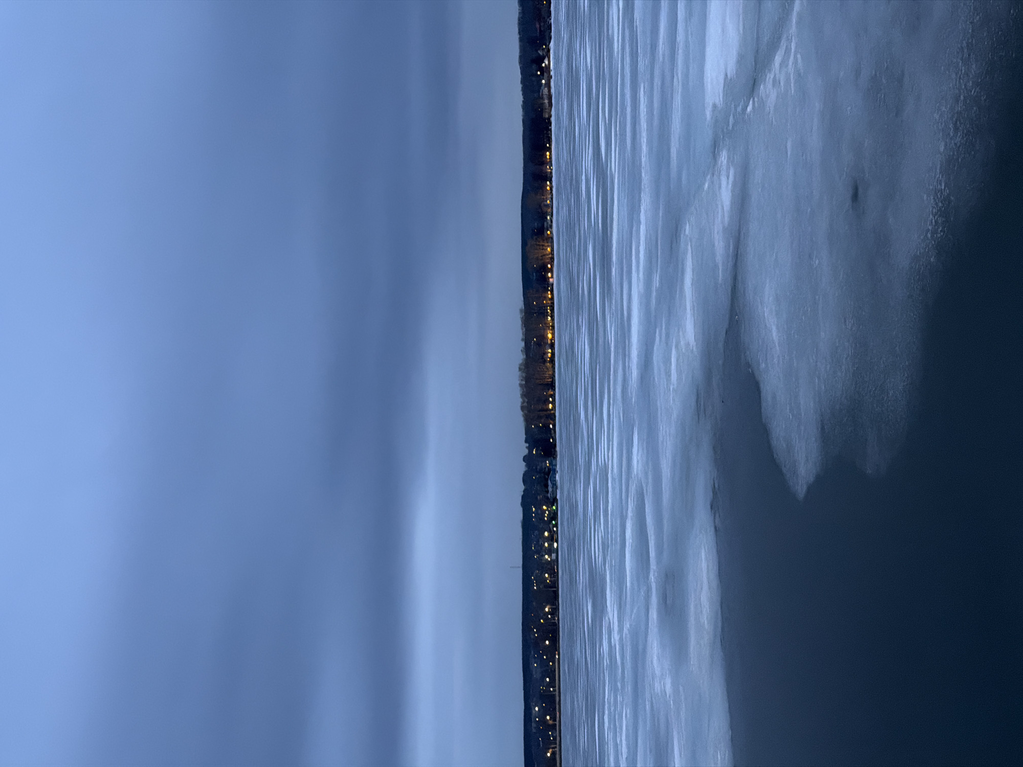 Twilight scenes captured across frozen Votkinsk, Russia including piano sculpture