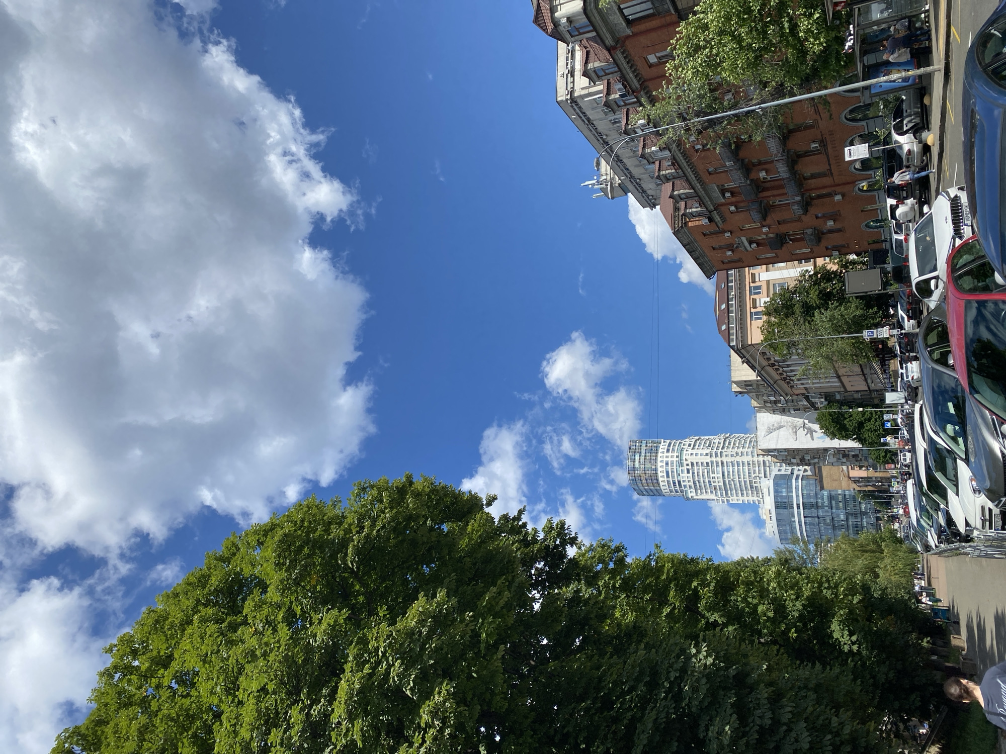 Street-level look at Kyiv's urban mix on a changeable summer day