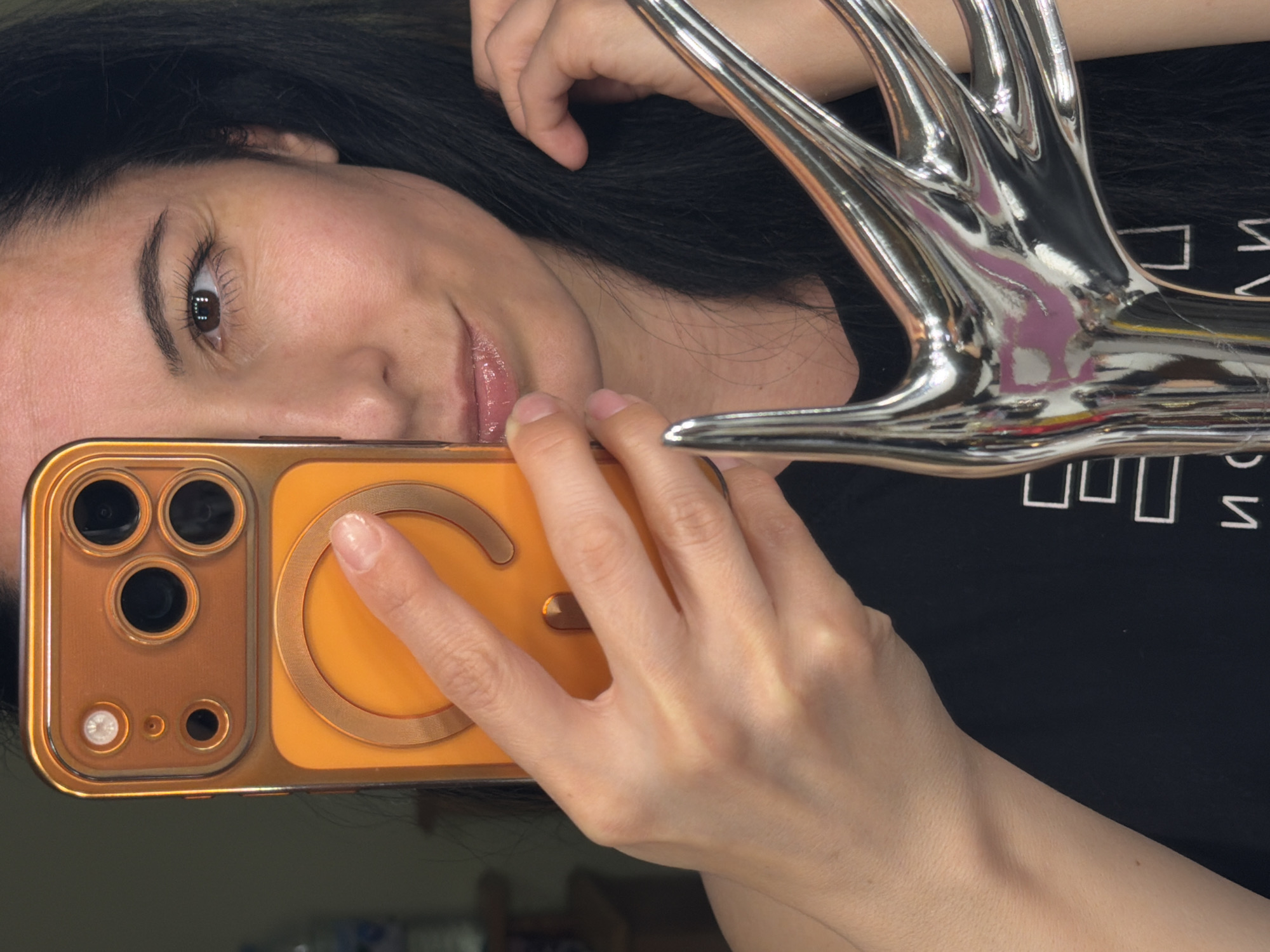 Woman takes selfie with decorative antler object in Pleven