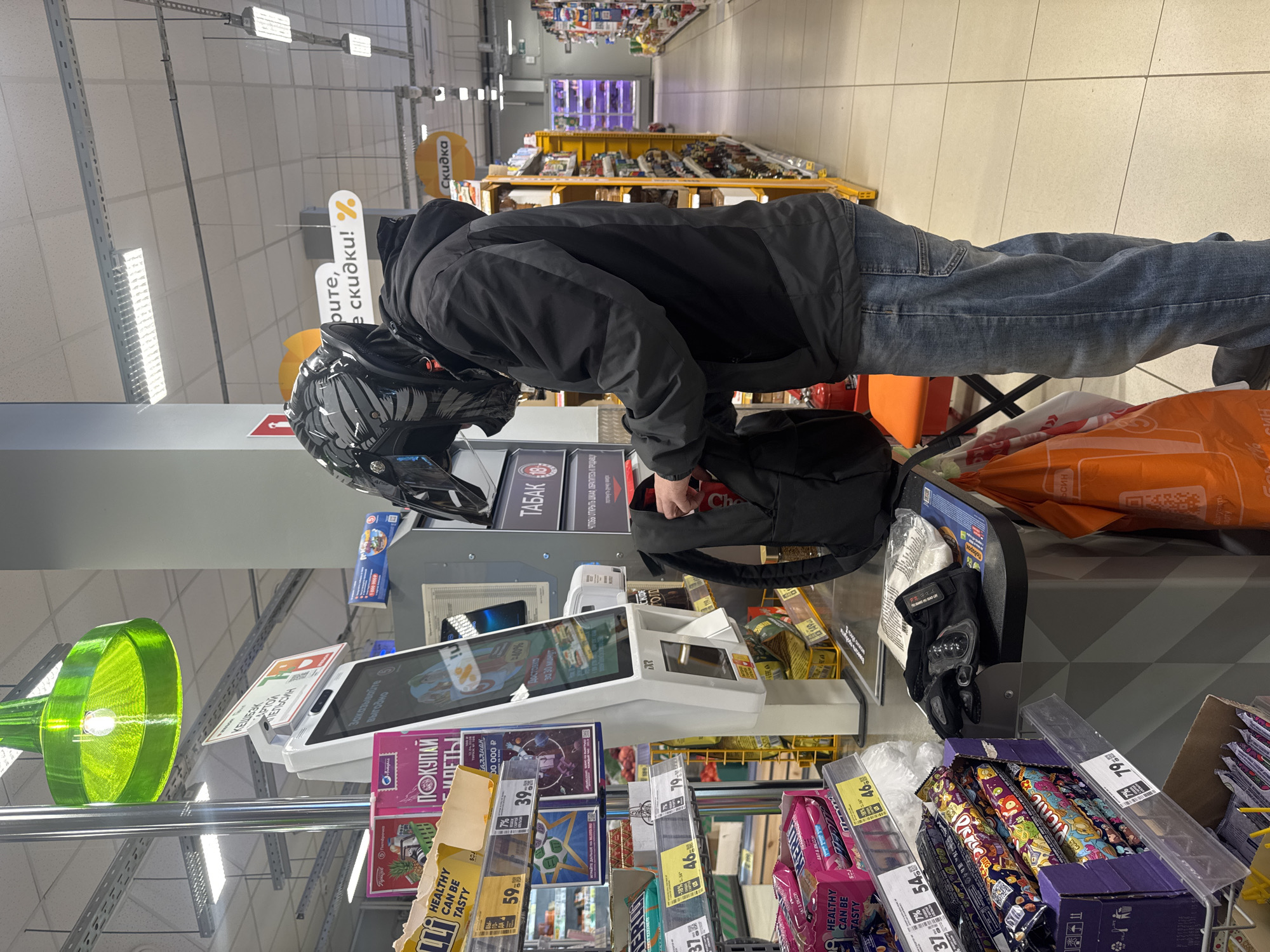 Motorcyclist makes quick supermarket stop in Chaikovsky, Russia