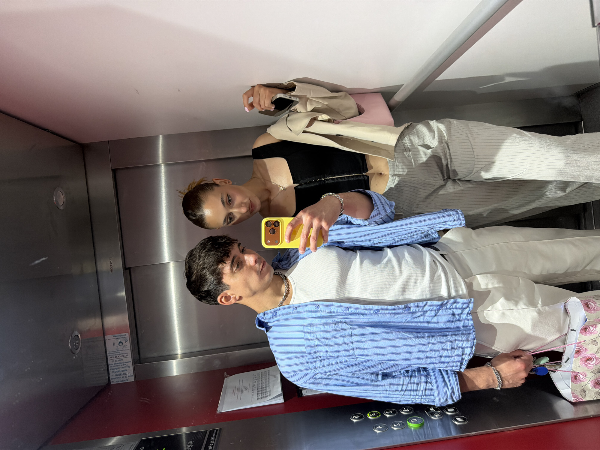 Couple Takes Mirror Selfie in Sofia Elevator