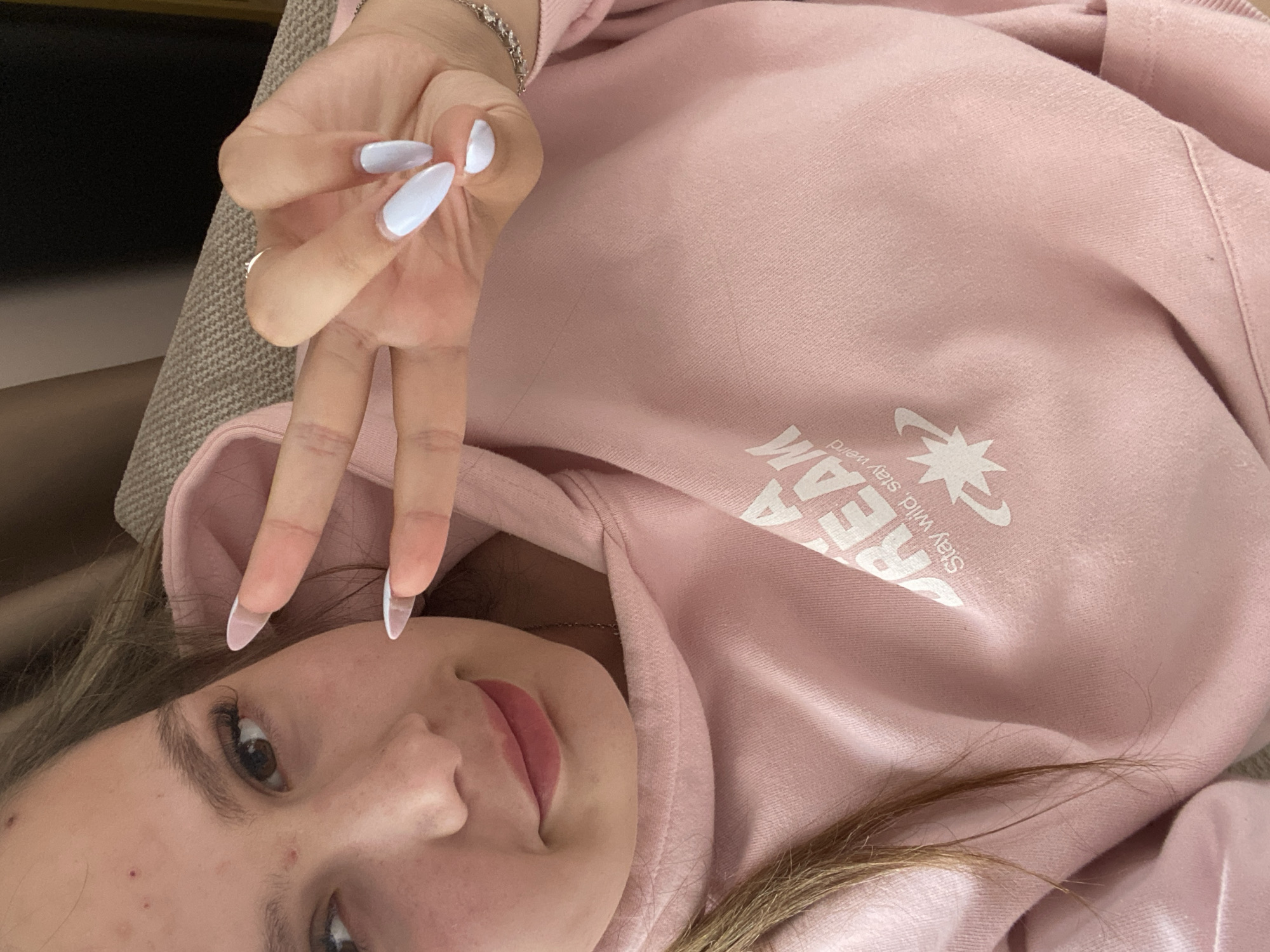 Person takes peaceful selfie in pink hoodie, Pletena Bulgaria