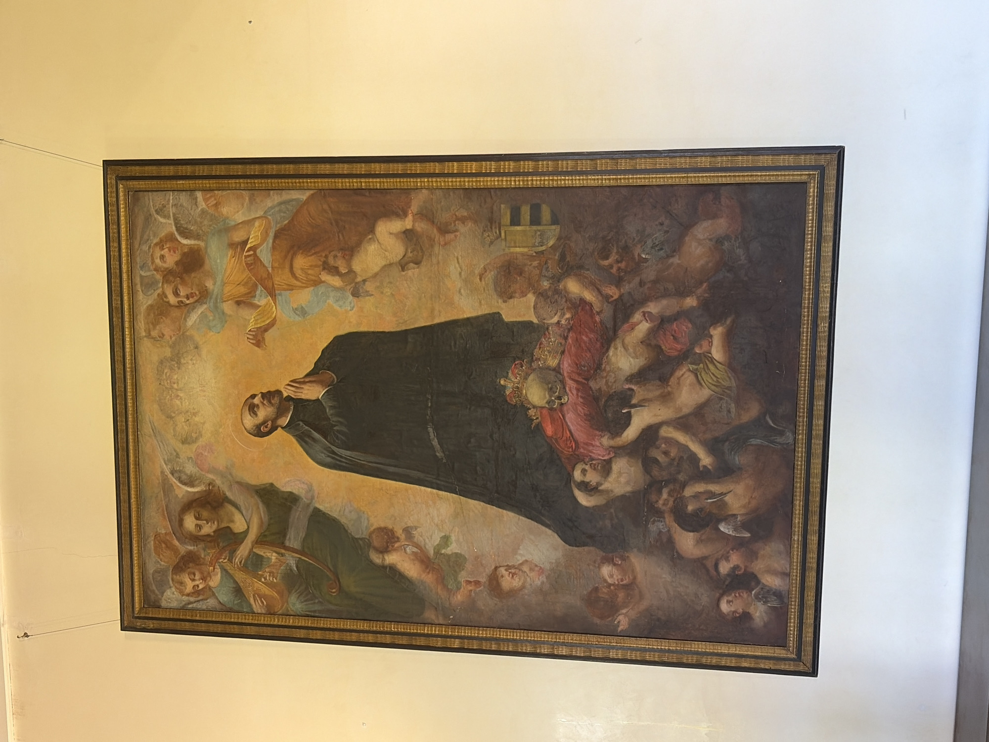 Visitor documents religious art, ornate ceiling at Borgia Palace