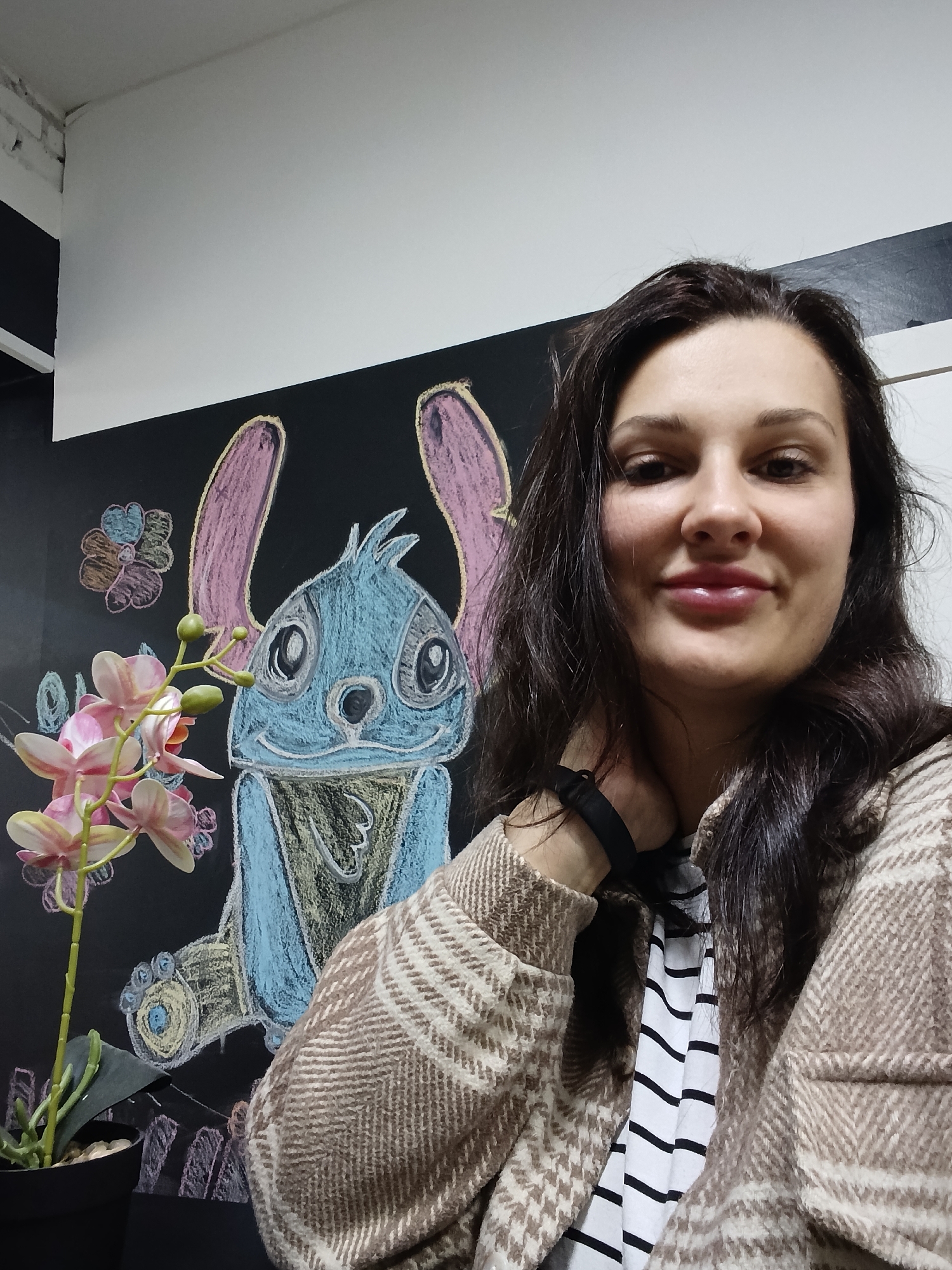 Woman takes selfies indoors in Birobidzhan, Russia