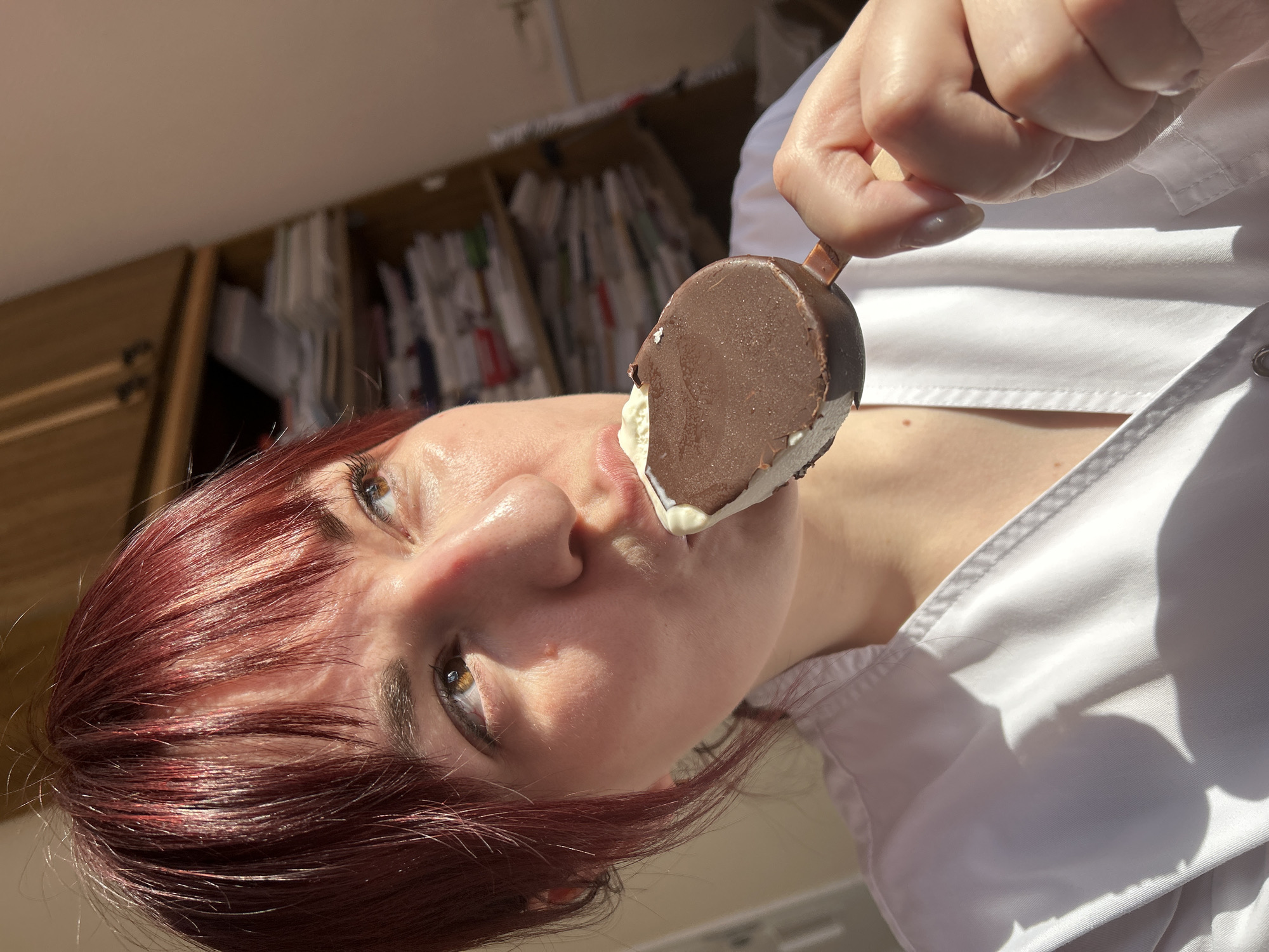 Woman enjoys chocolate ice cream in Foki, Russia