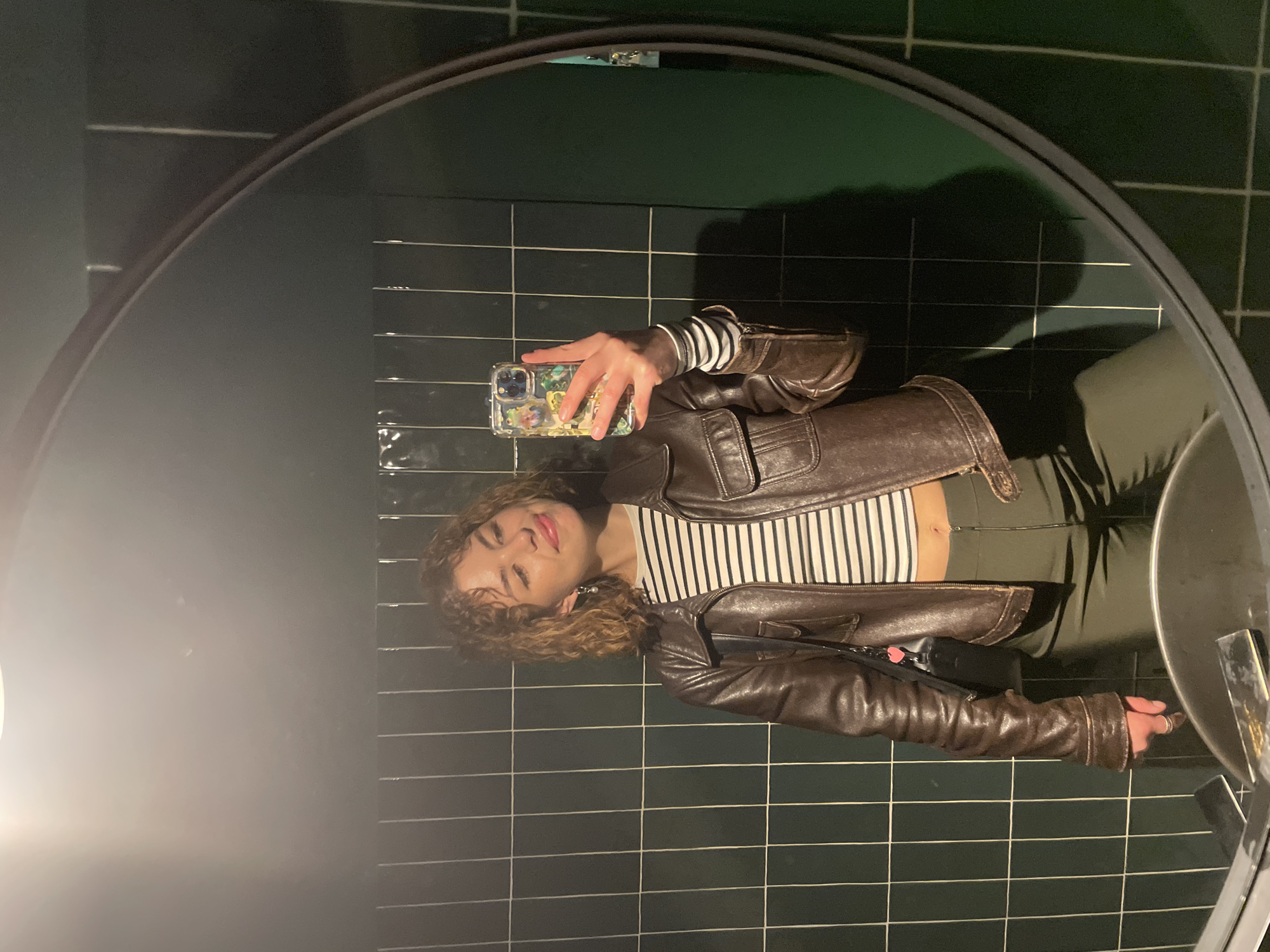 Woman takes mirror selfie in Budva, Montenegro