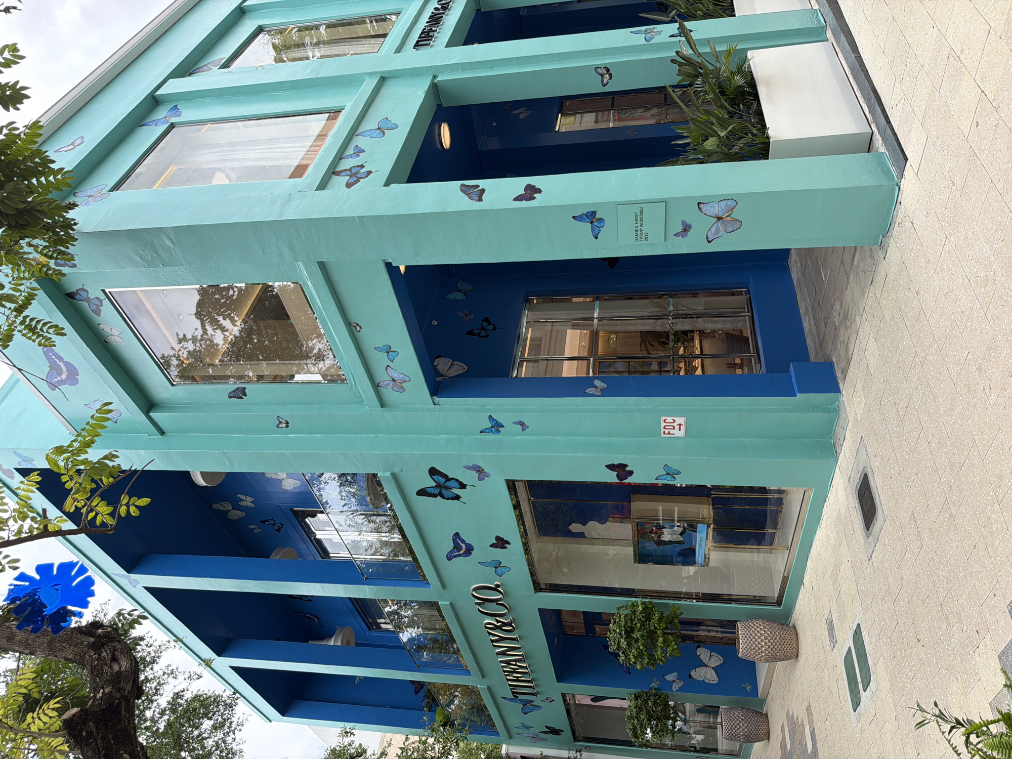 Tiffany building displays butterfly artwork in turquoise and blue