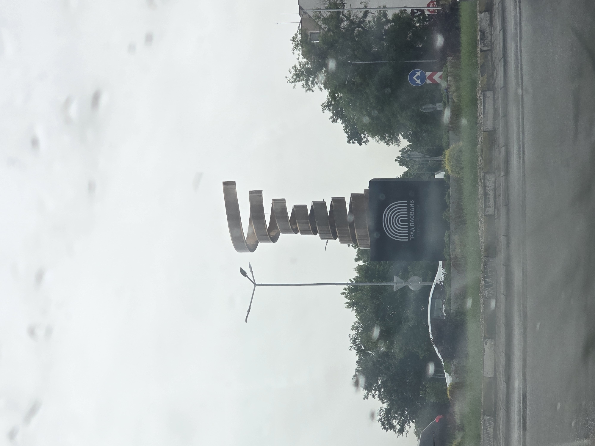 Modern metal sculpture spotted during rainy morning