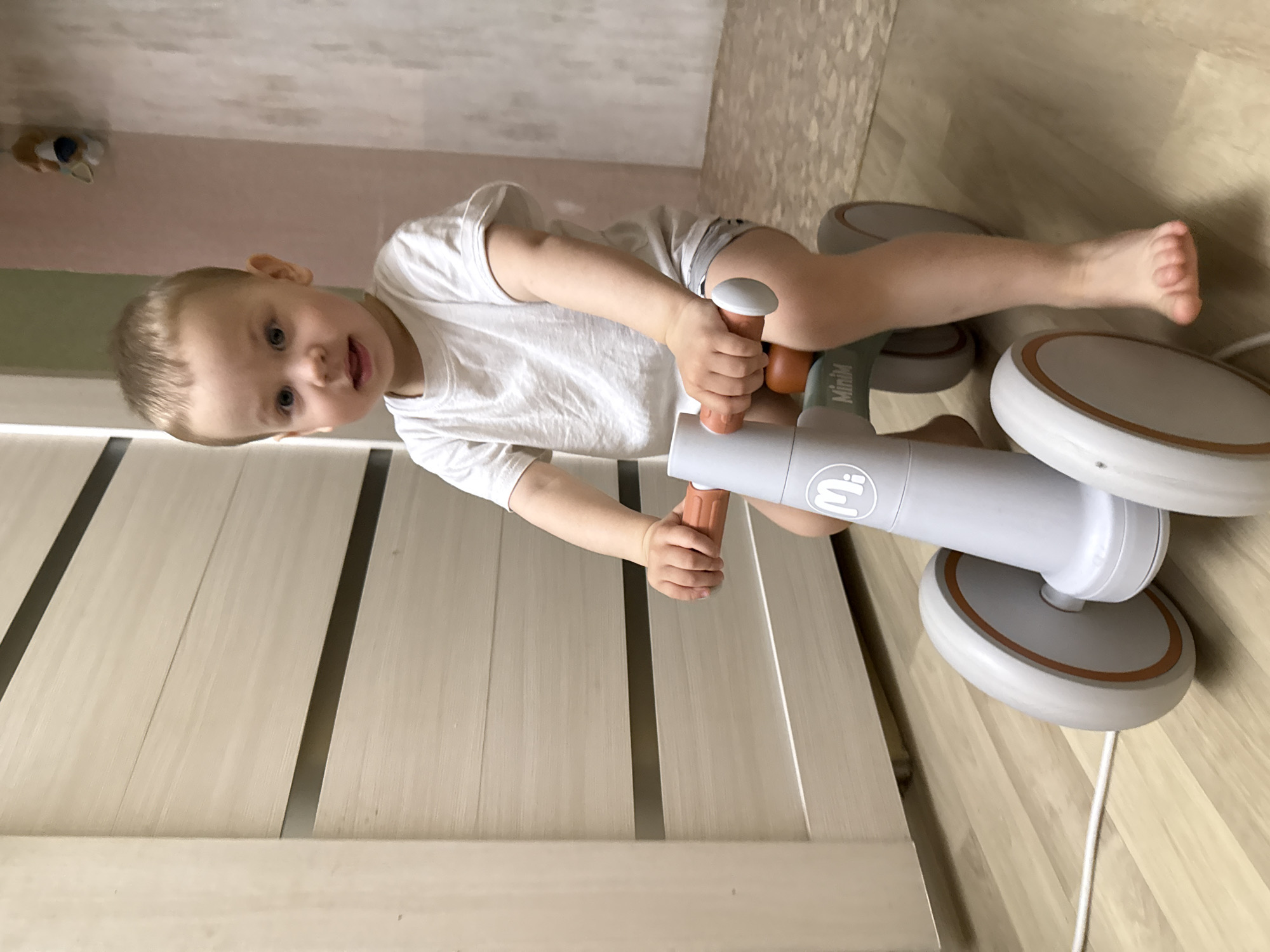 Toddler with curious expression observed indoors early Friday morning