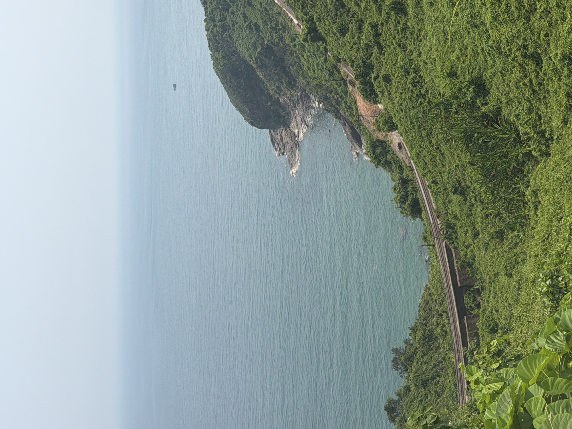 Coastal hillside with railway tracks observed near Huế, Vietnam