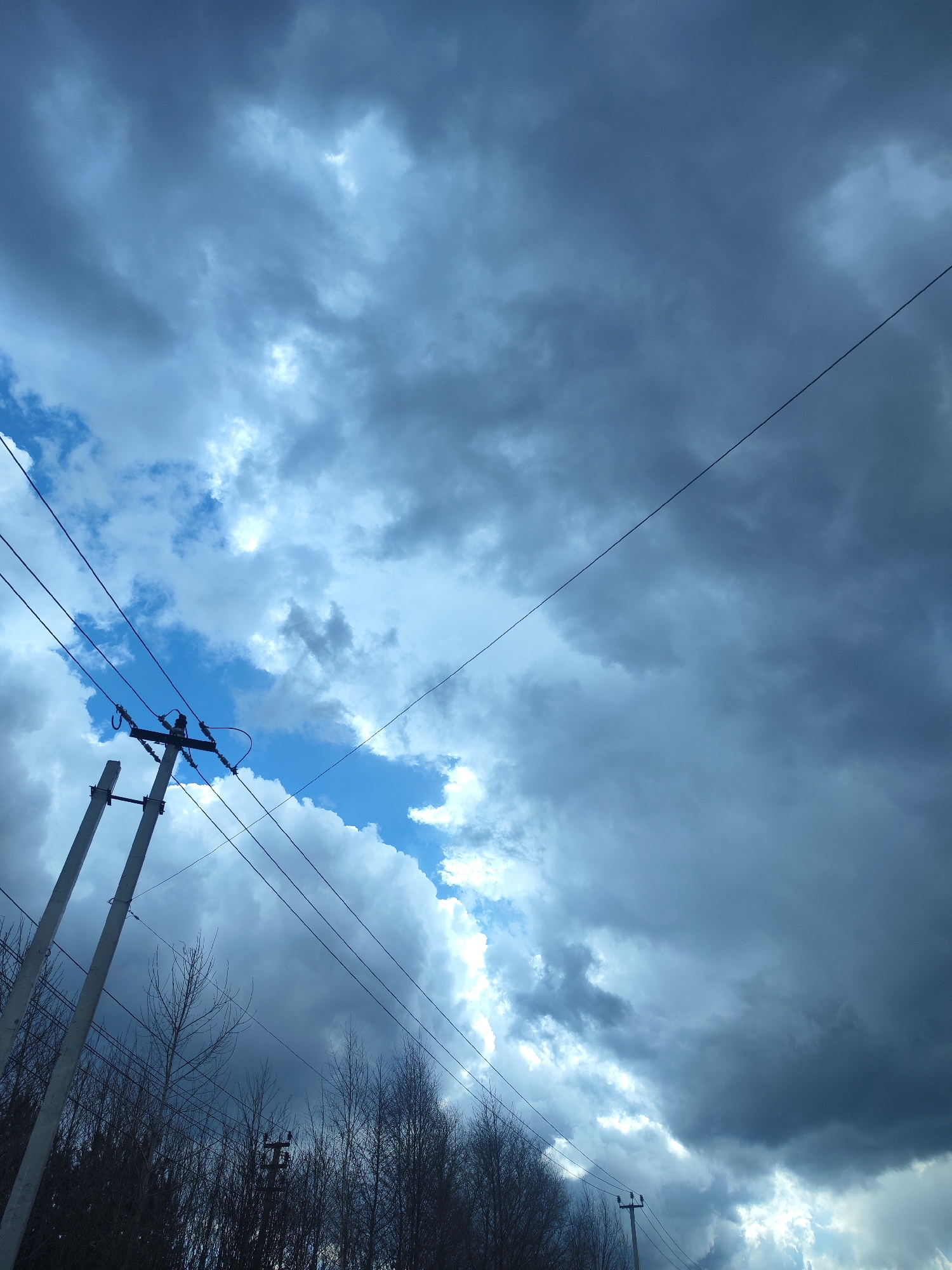Storm clouds gather over routine errands in Chaikovsky, Russia