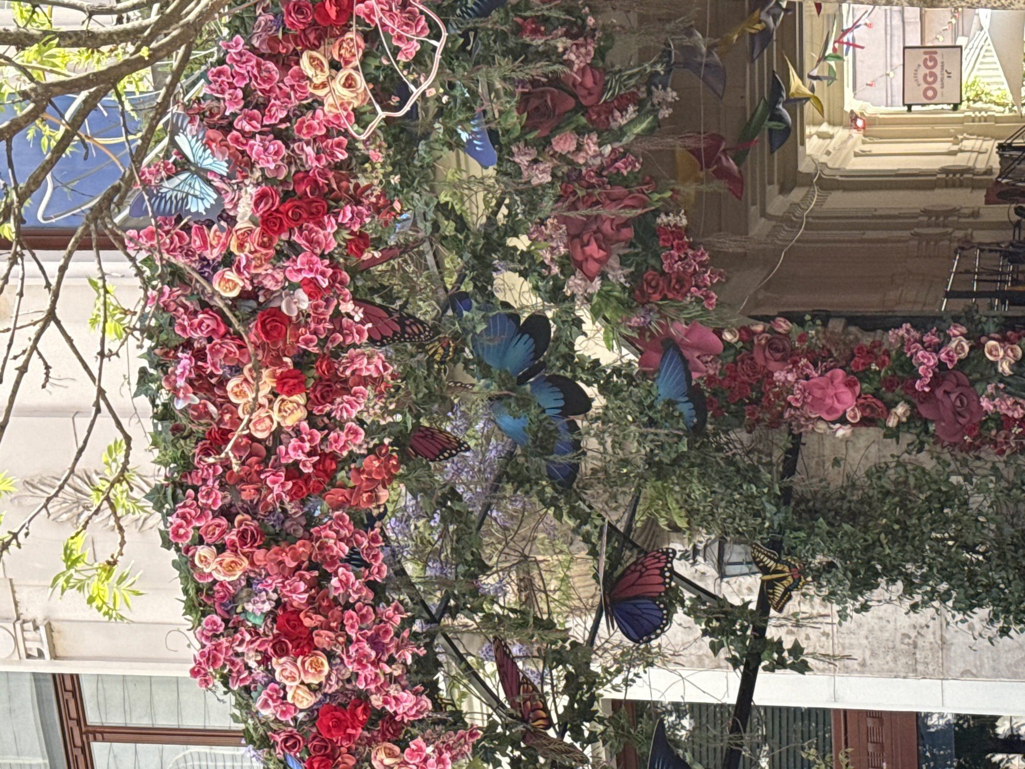 Floral archway and courtyard scenes captured in Budapest