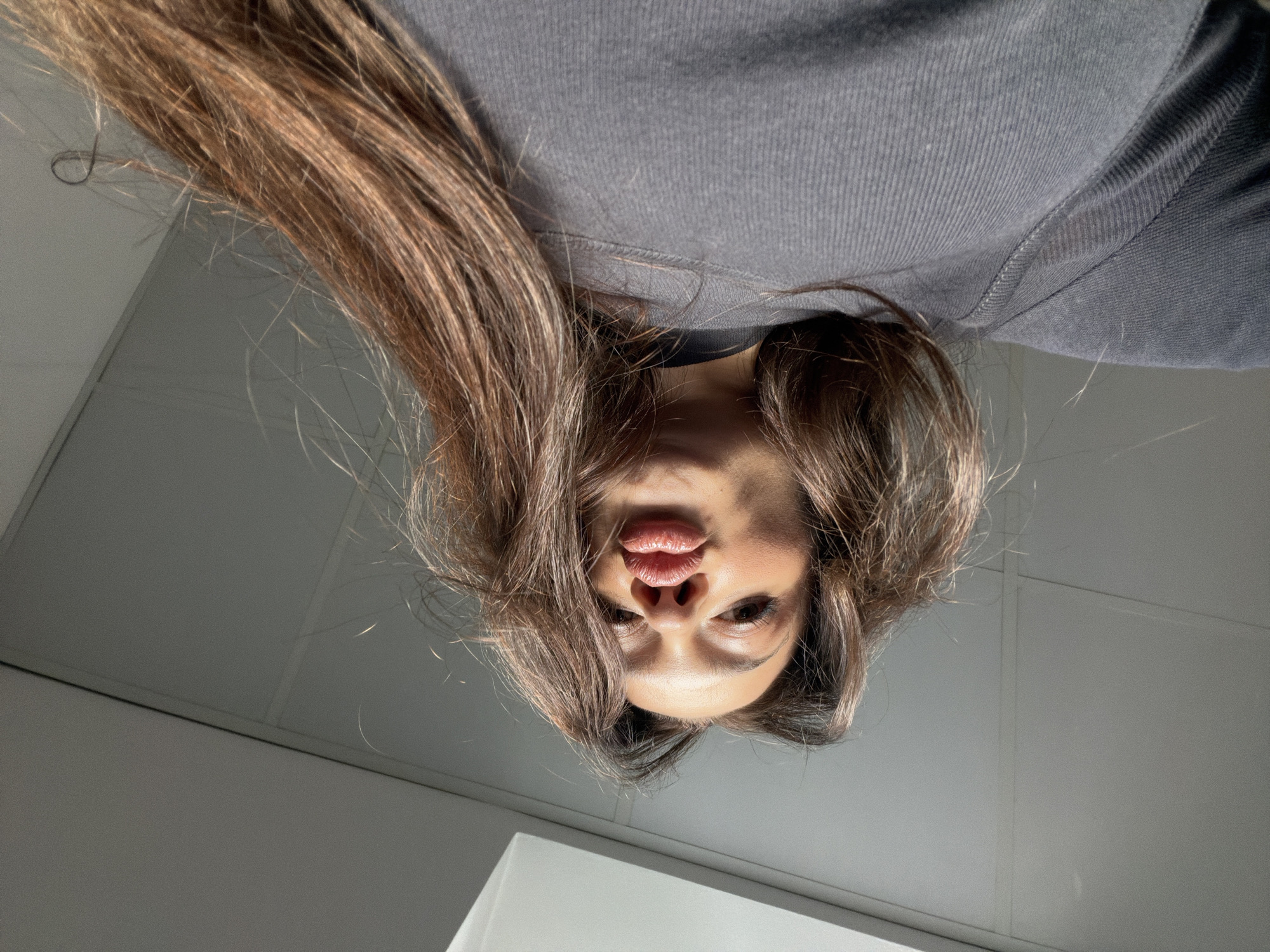 Woman takes selfies in Varna office space early morning