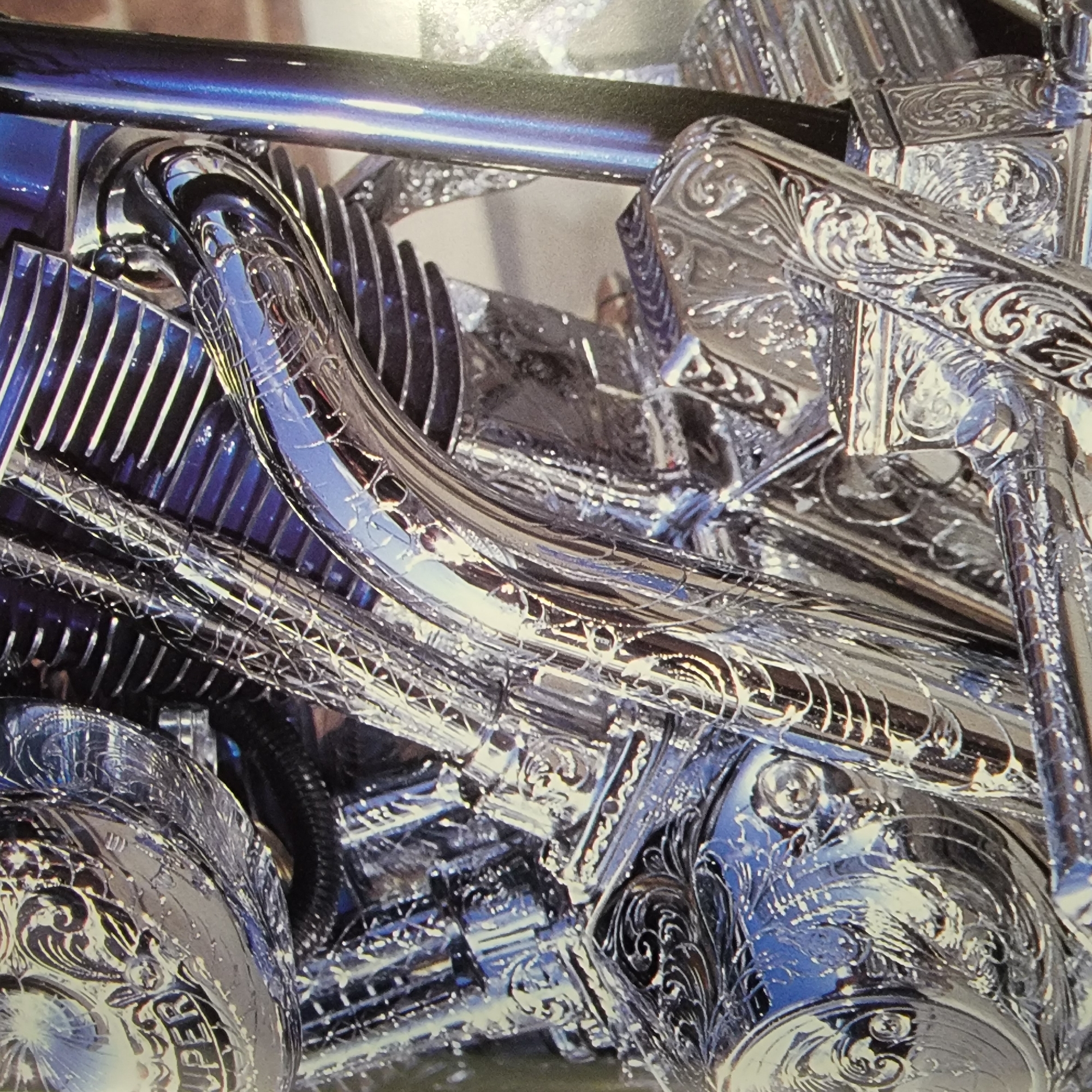 Close-up showcase of heavily customized motorcycles with chrome and custom paint