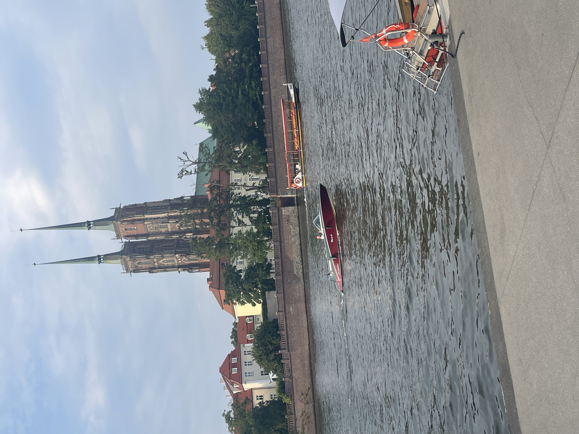 Wrocław's Oder River with cathedral skyline on a cloudy afternoon