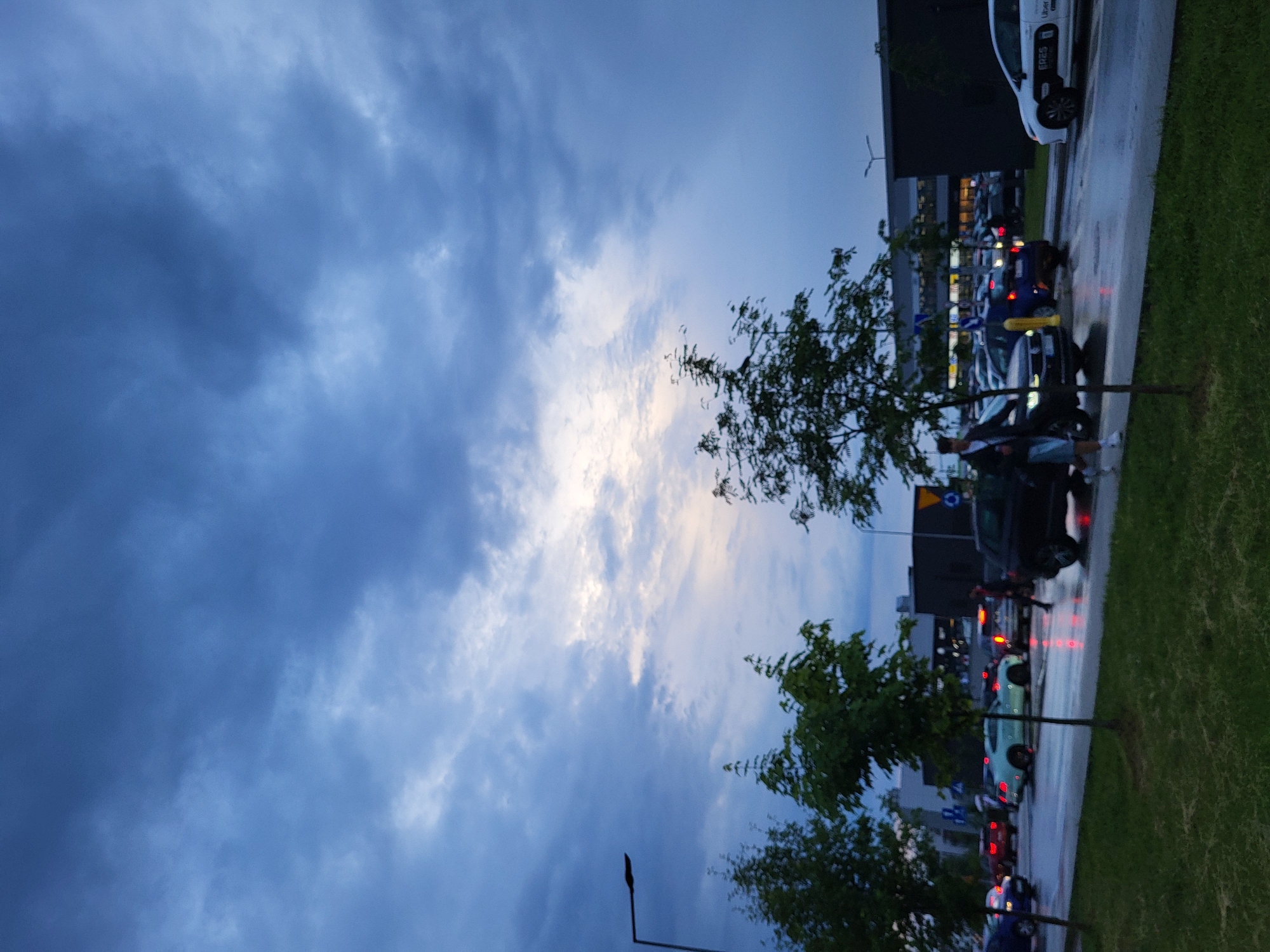 Rainy evening documented across urban residential neighborhood, June 2026