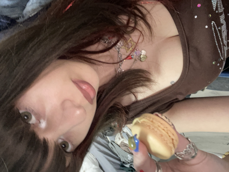 Woman enjoys macarons during afternoon outing in Ra'anana