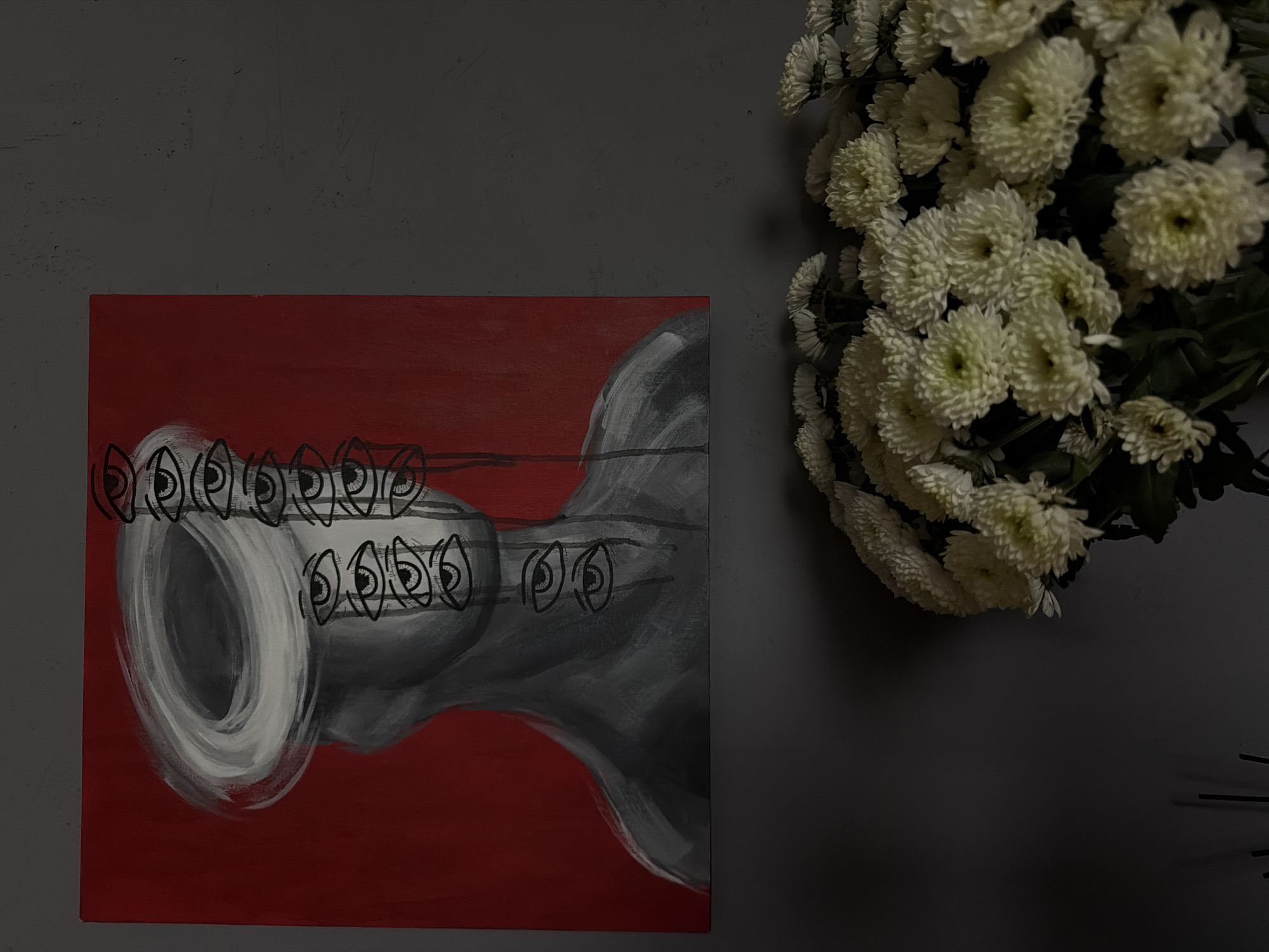 Abstract art display observed alongside flowers in Ust-Ilimsk