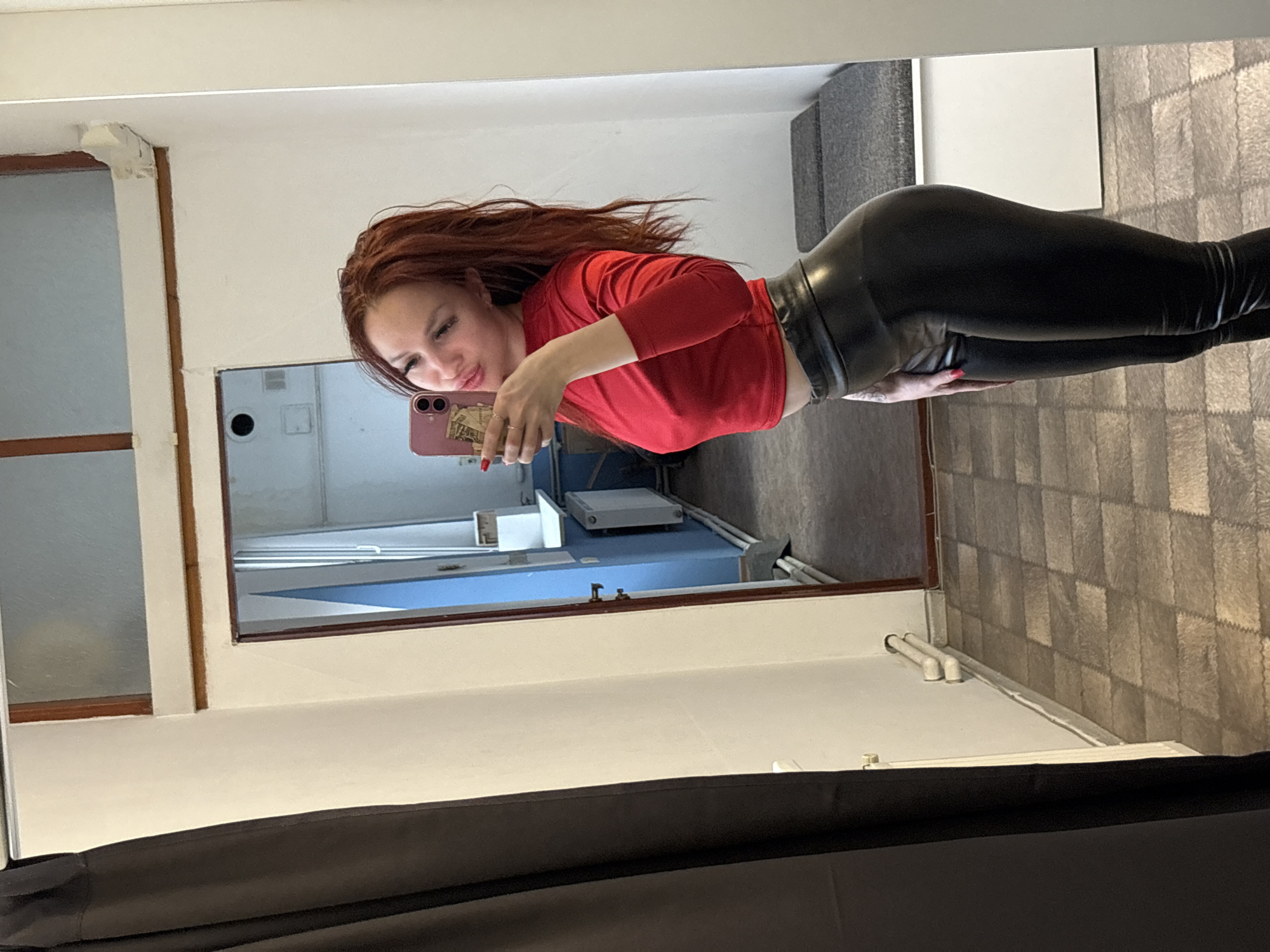 Woman takes mirror selfie in Simferopol home