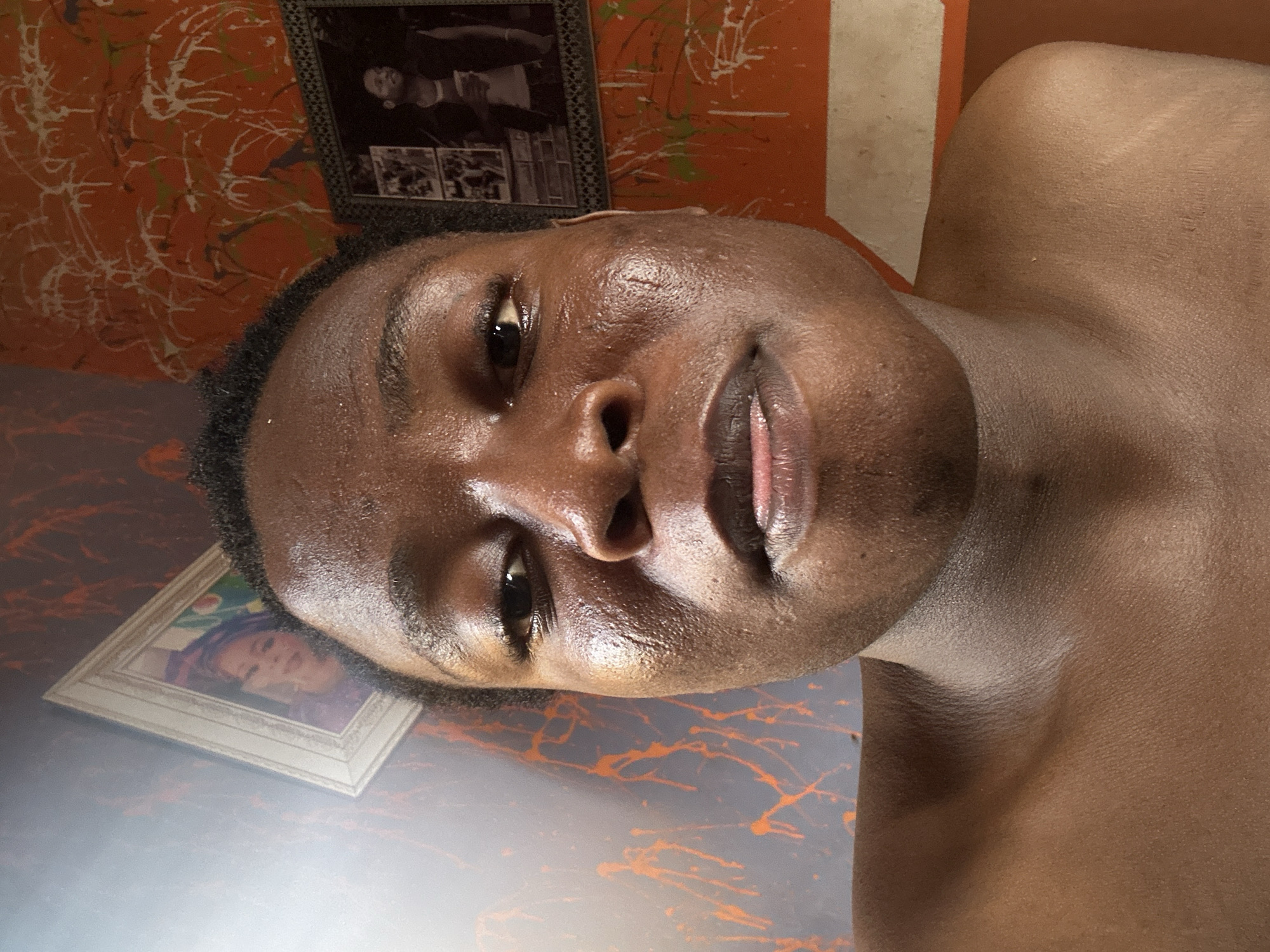 Person documents playful selfie session with household products