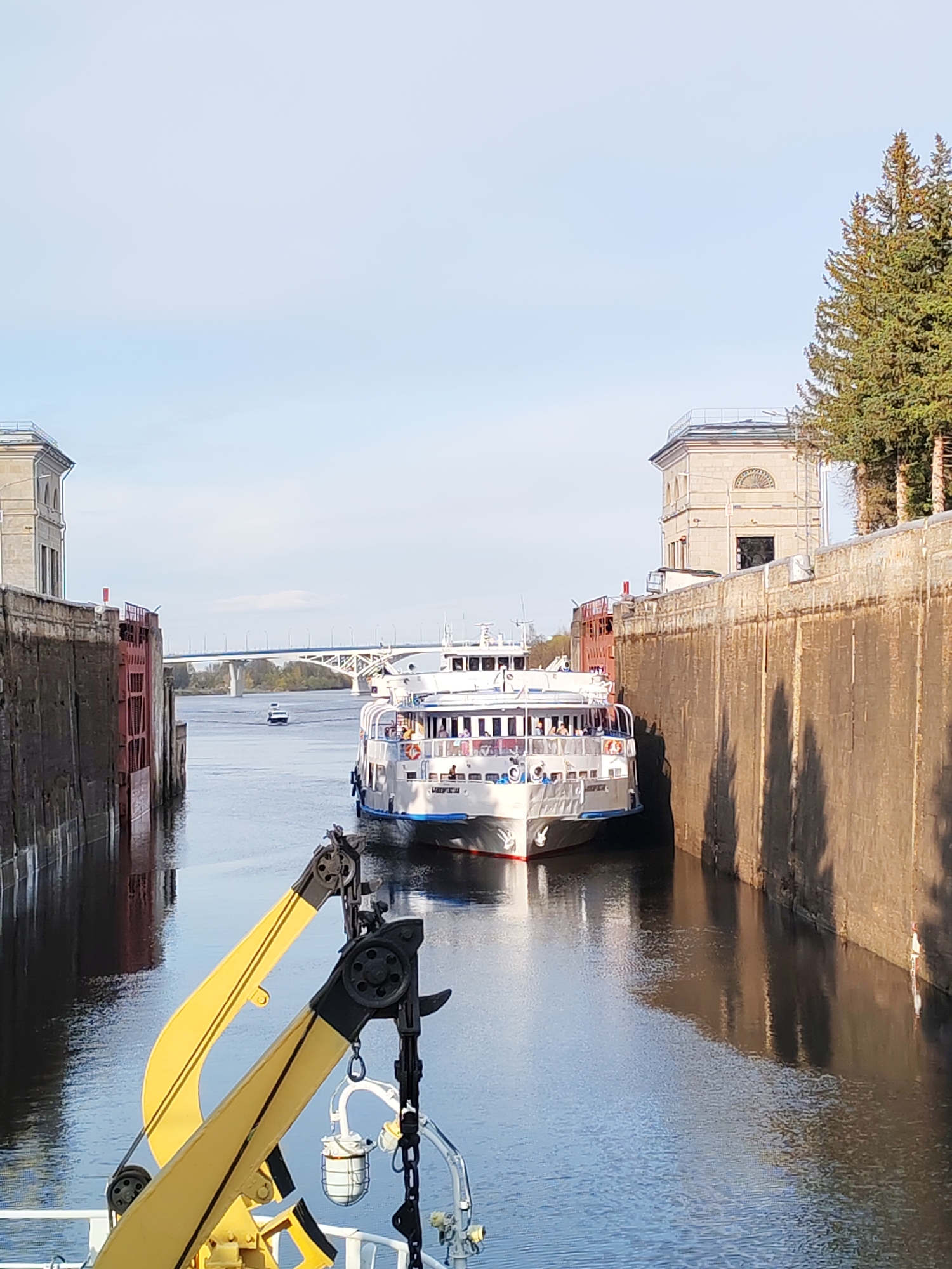 Passenger ship and barges transit canal locks, waterways