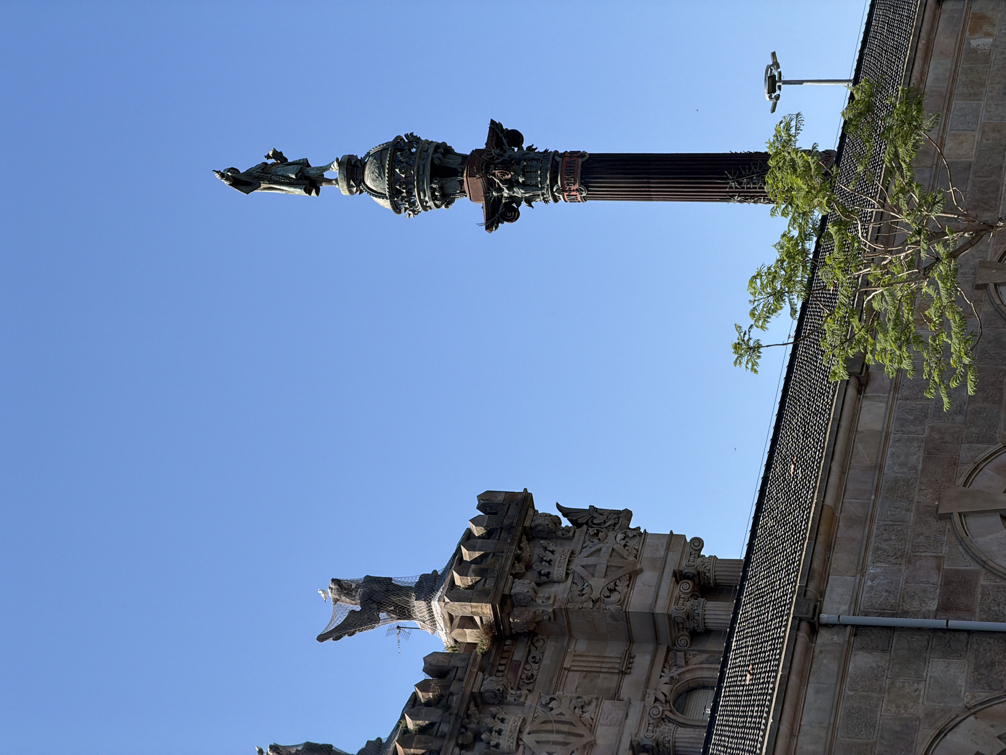 Barcelona waterfront afternoon: historic facades, cable cars, and harbor plazas