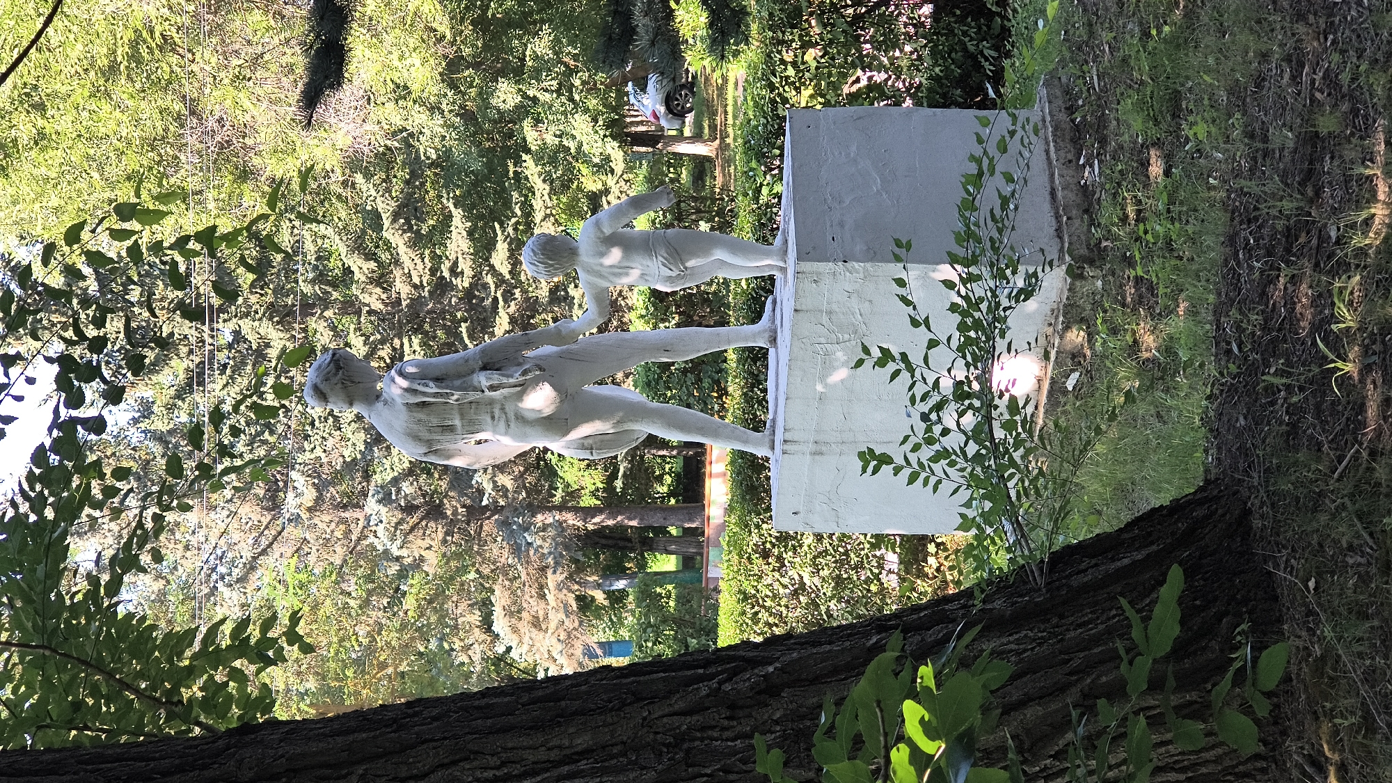 Public art and summer greenery in a Mikhaylovka park