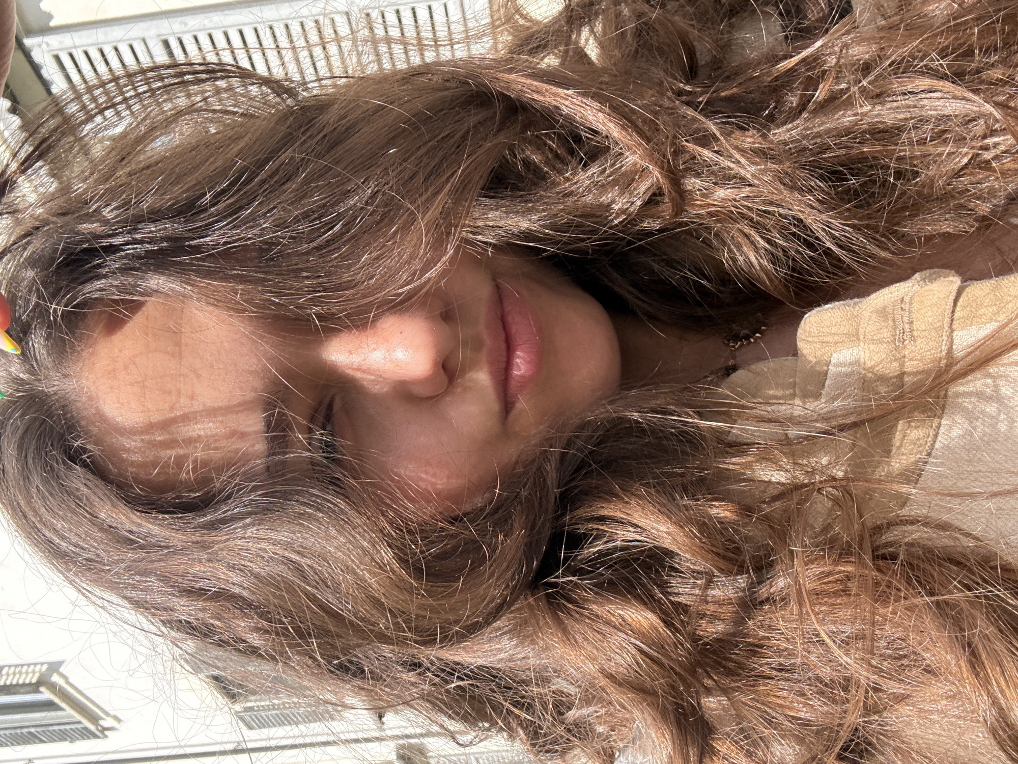Woman filmed in Milan plaza amid modern architecture