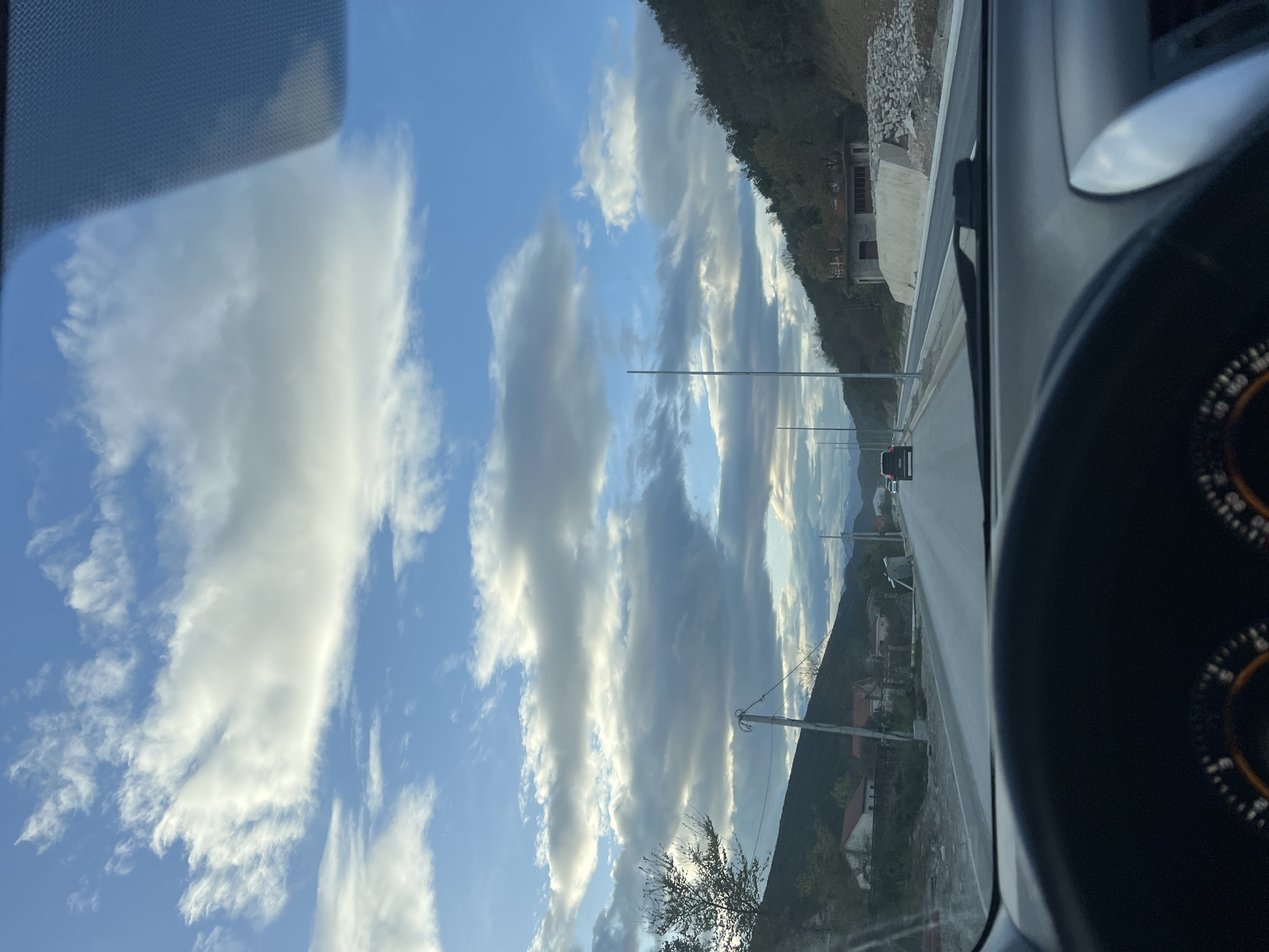 Driver captures industrial Montenegro landscape during brief afternoon journey
