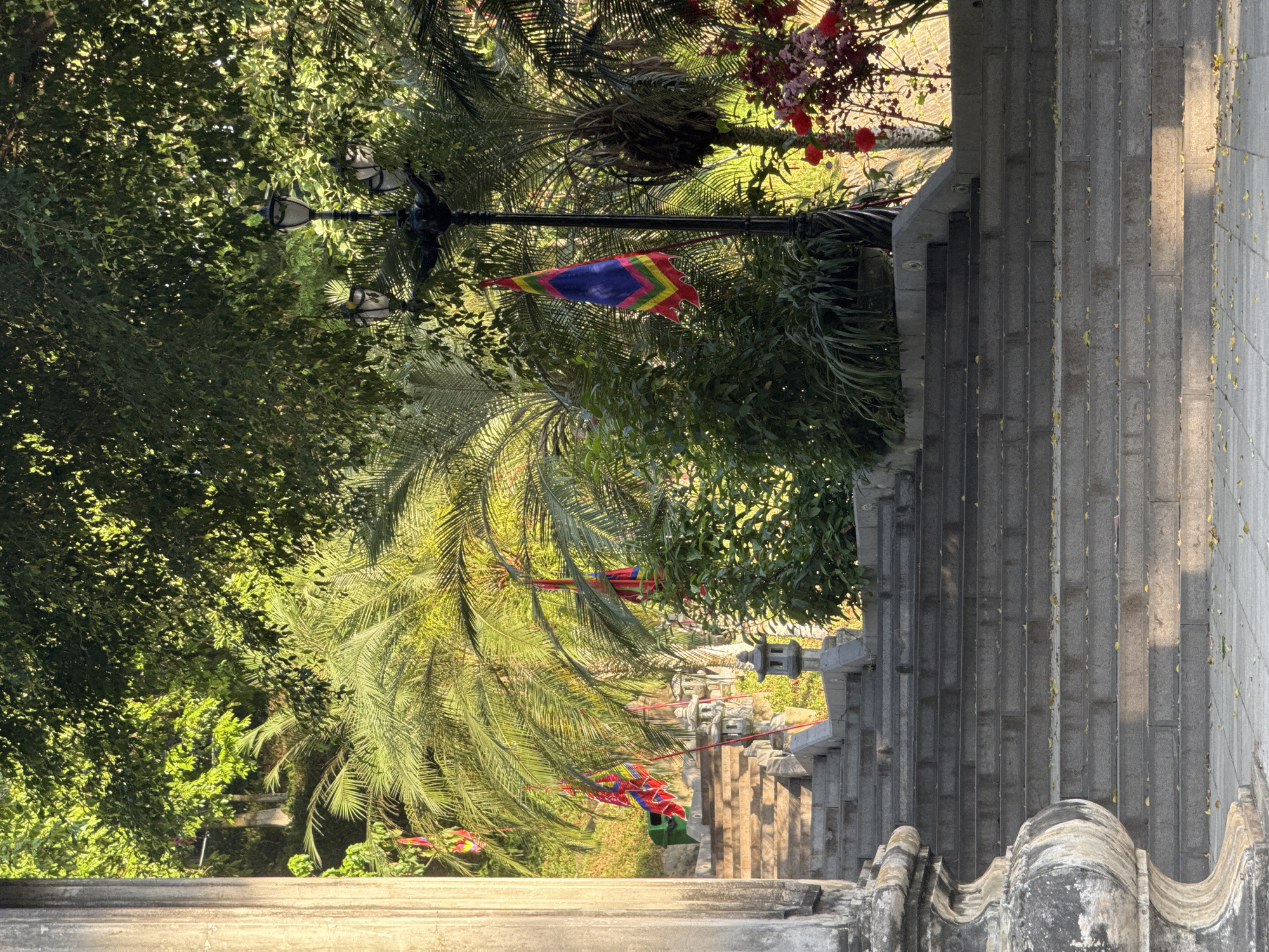 Tourist documents temple gate and street scenes in Lao Cai