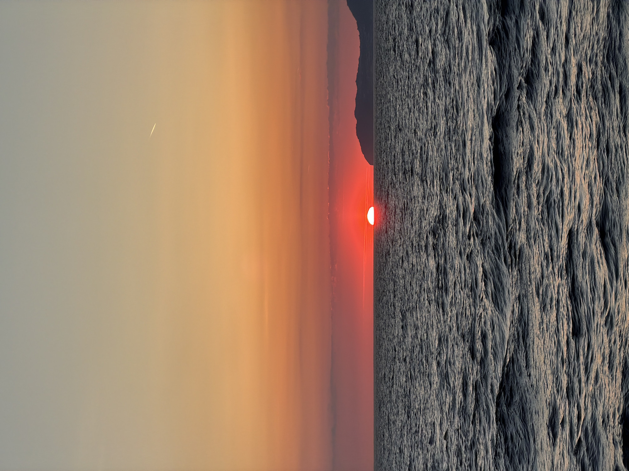 Sunset observed in Italy with unidentified linear object visible
