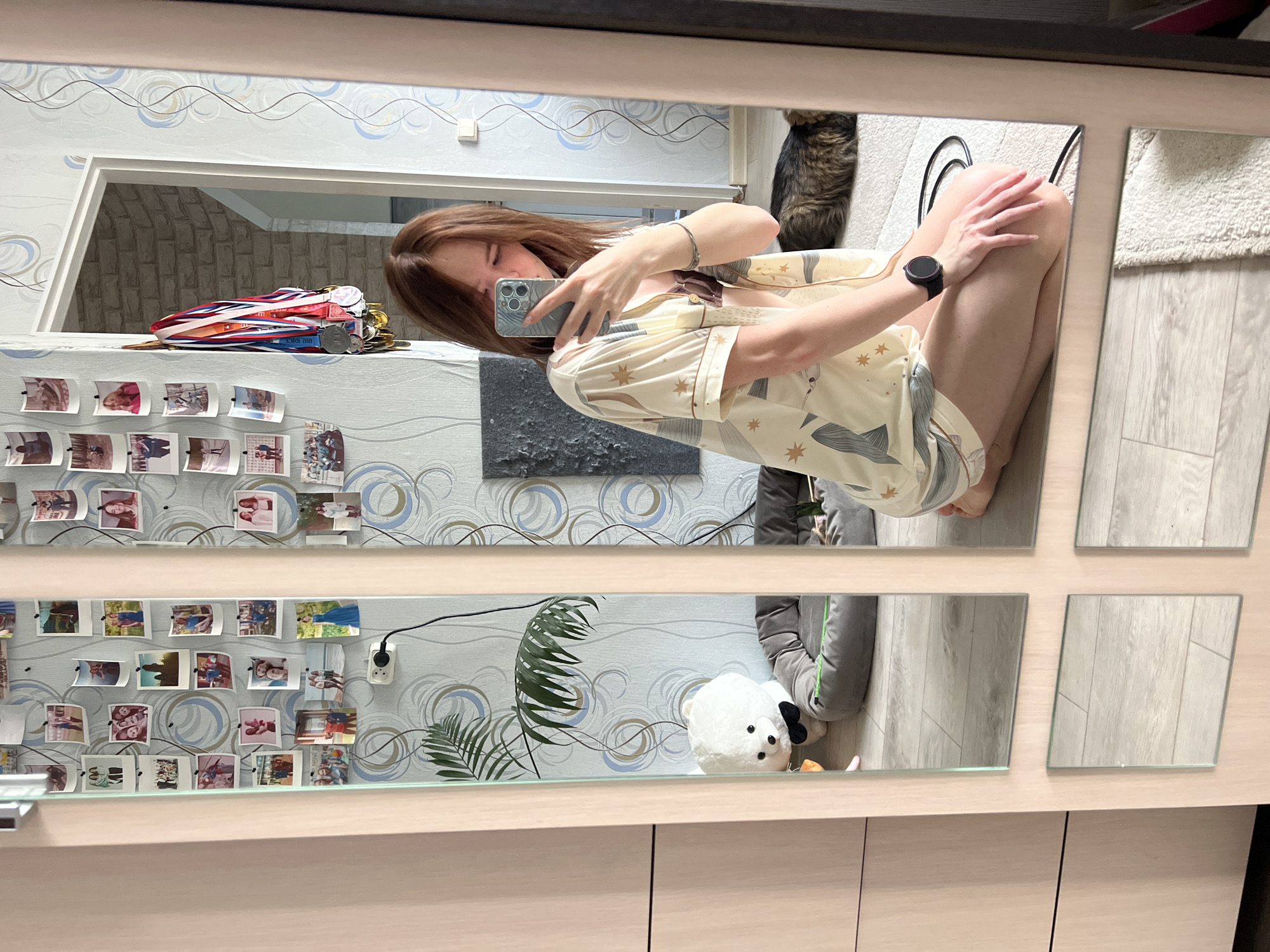 Woman documents personal moments with cat, flowers in Chaikovsky