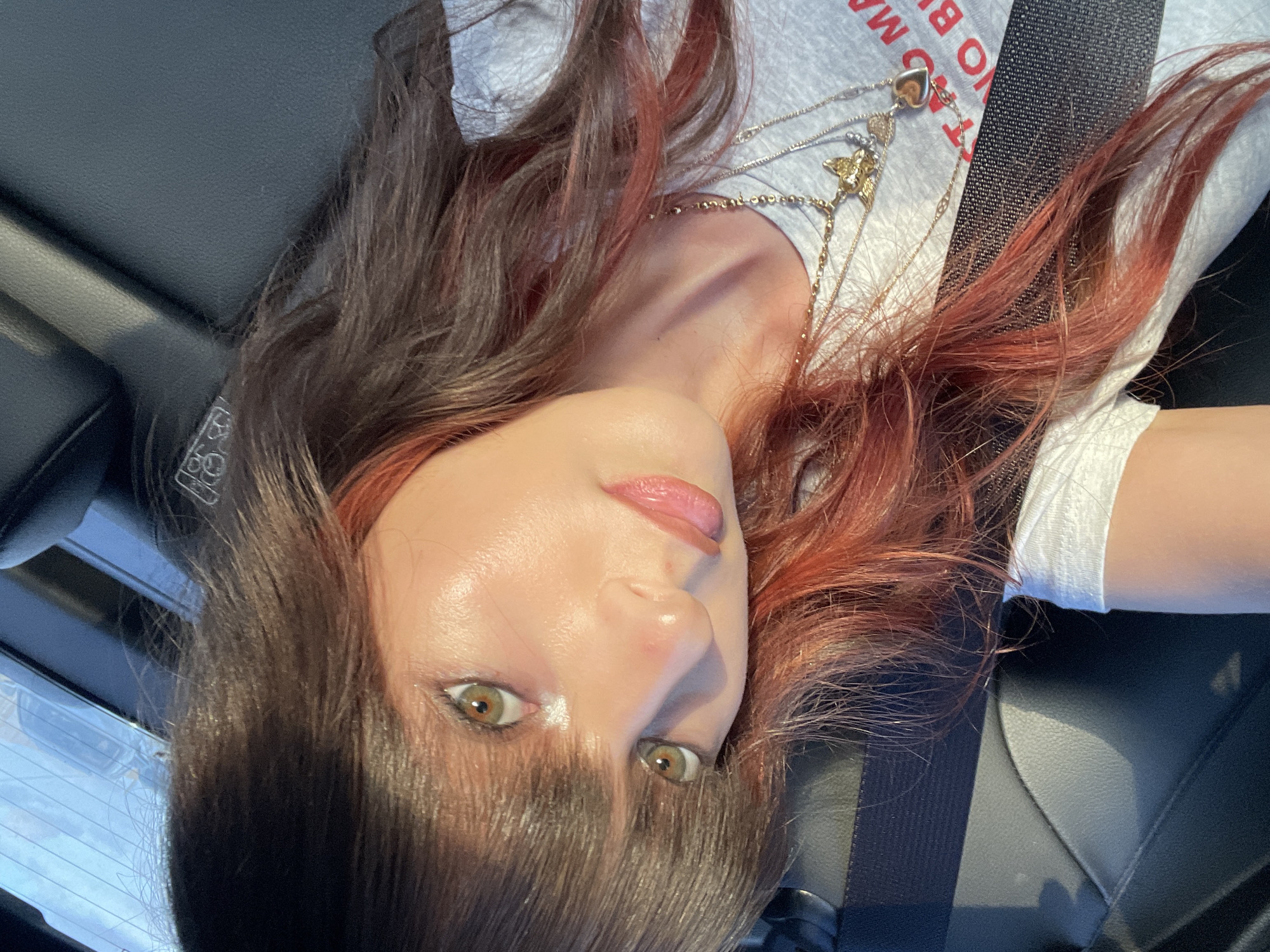 Woman takes selfie with butterfly necklace in Raanana