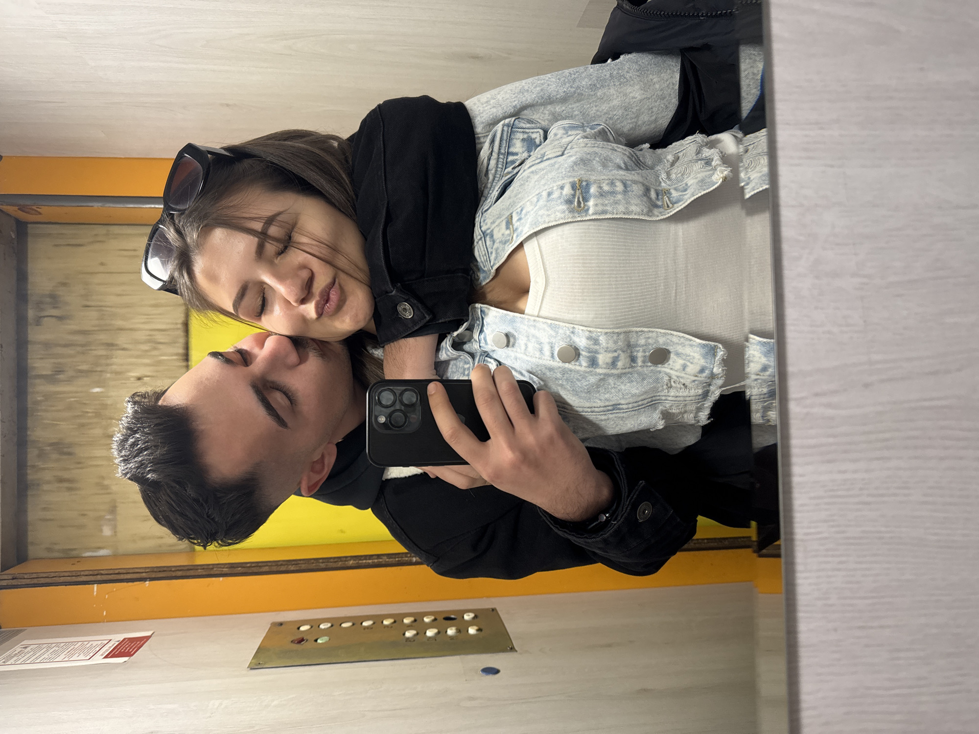 Two people captured in mirror reflection in Sofia