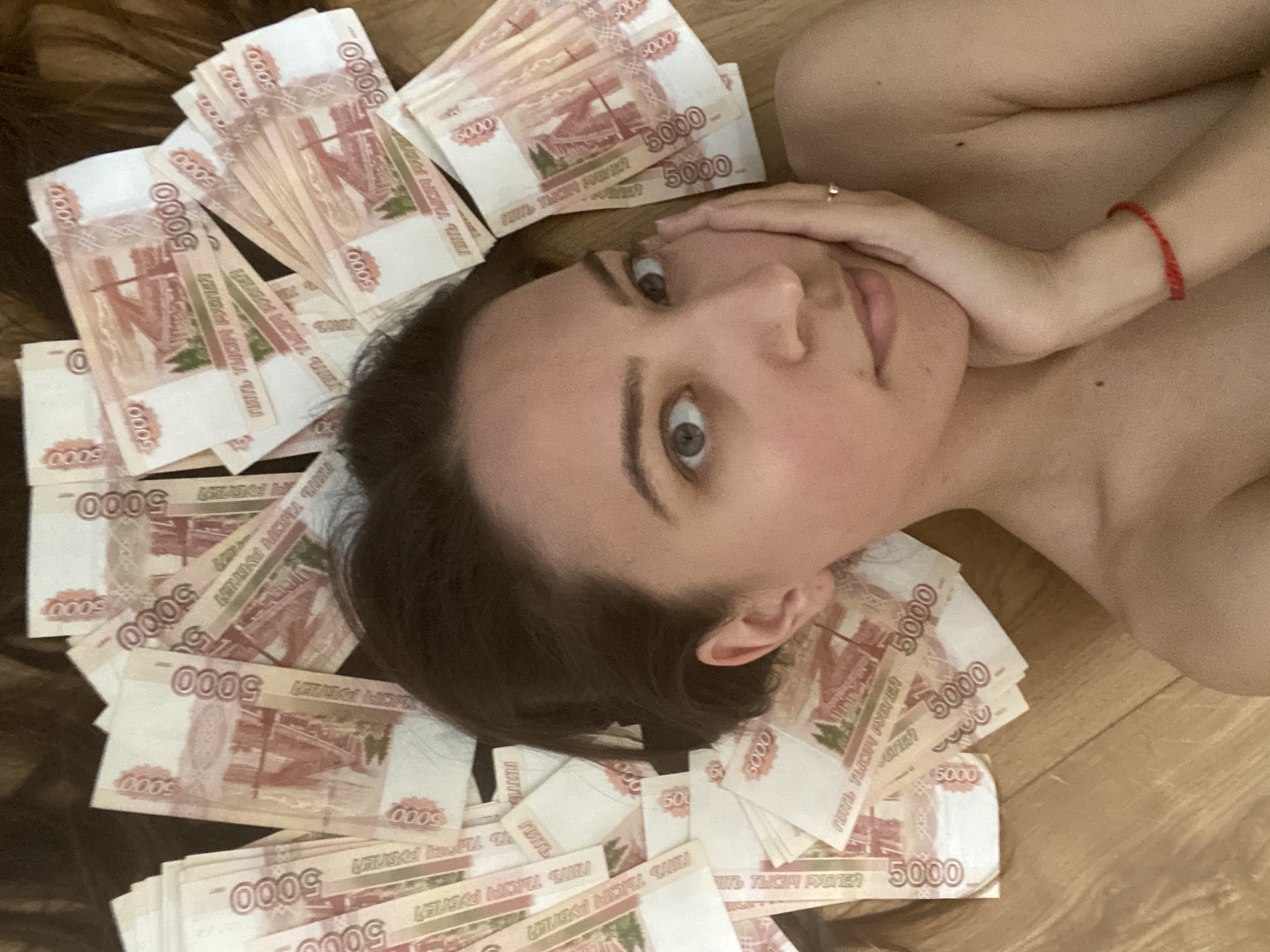 Woman found lying amid scattered Russian banknotes in Sevastopol