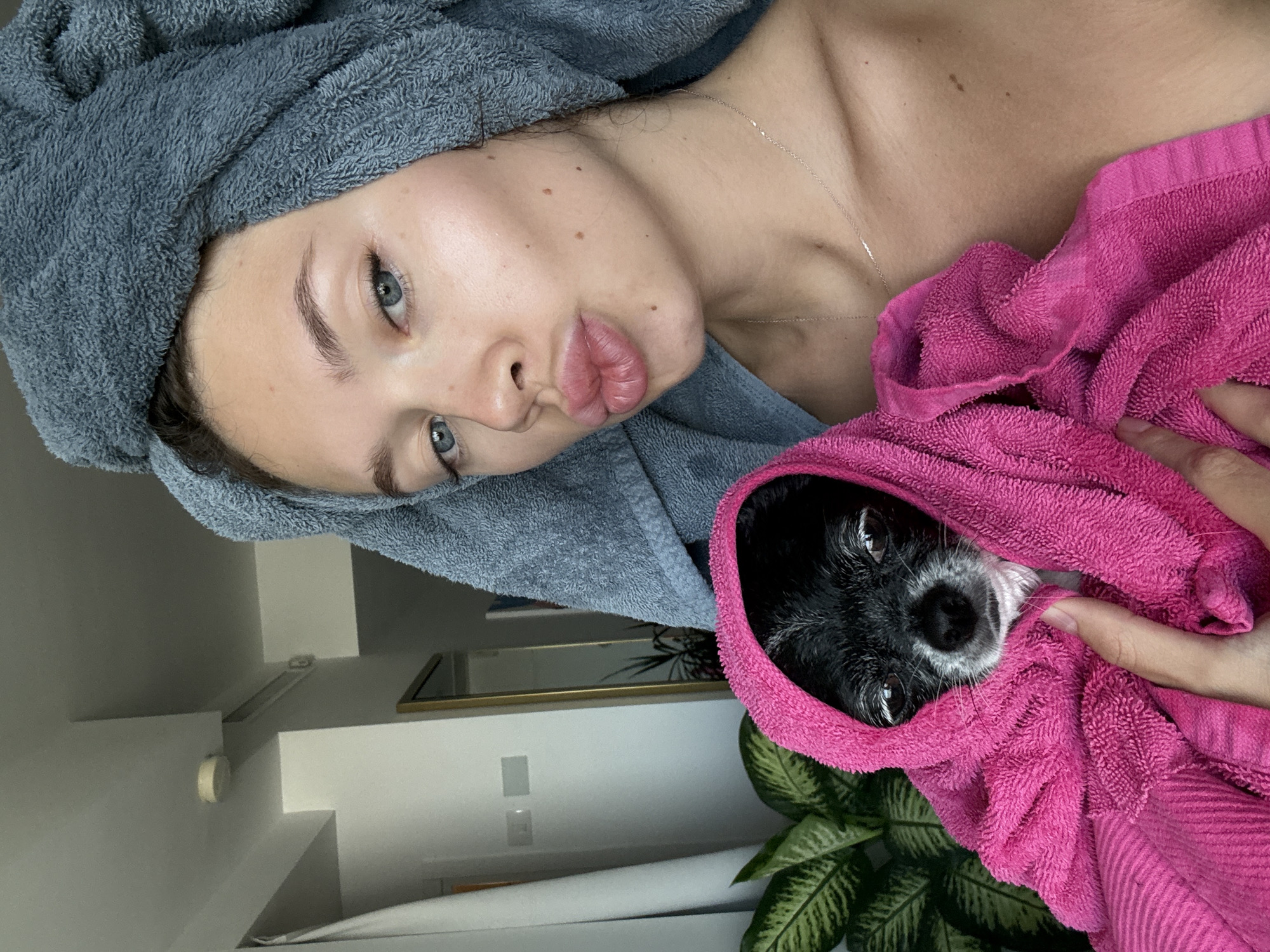 Post-bath towel selfie with a chihuahua mix in Tel Aviv