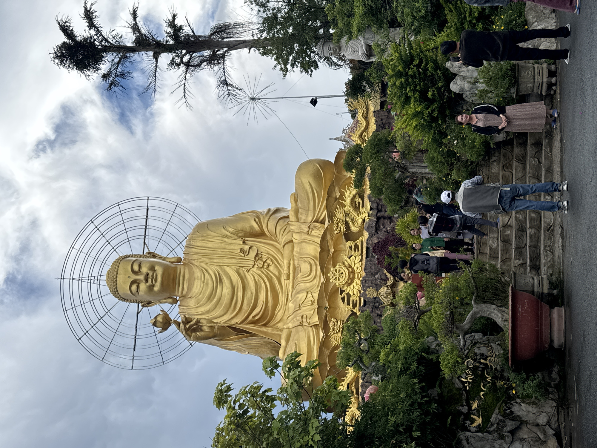 Golden Buddha statue draws visitors in Đà Lạt Vietnam
