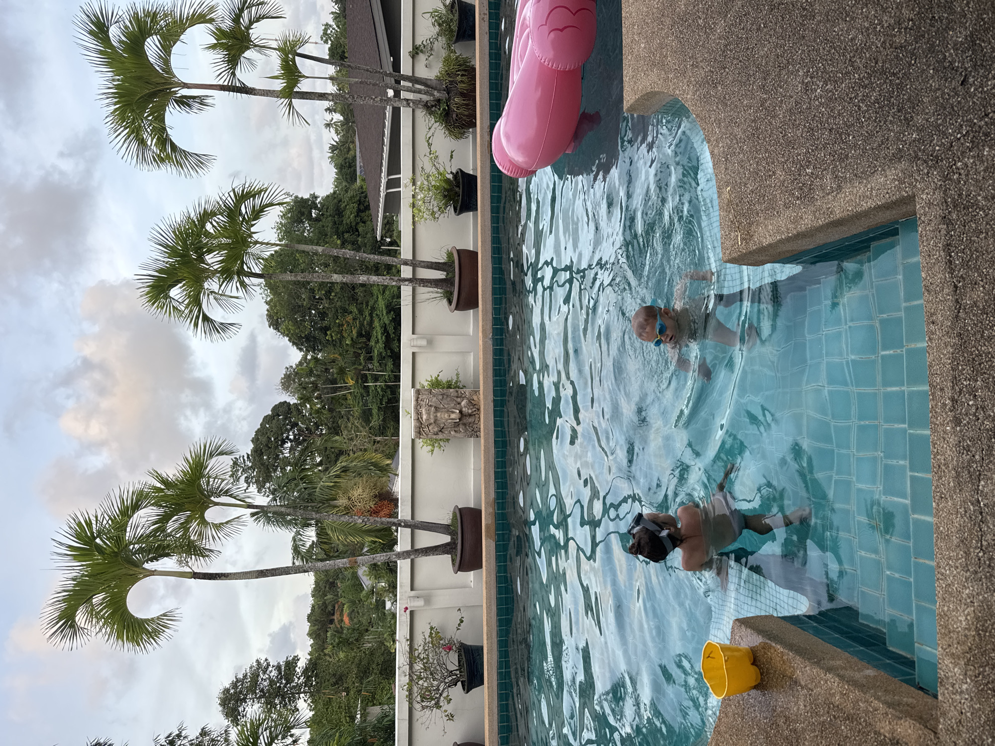 Child swims with inflatable flamingo in Rawai pool