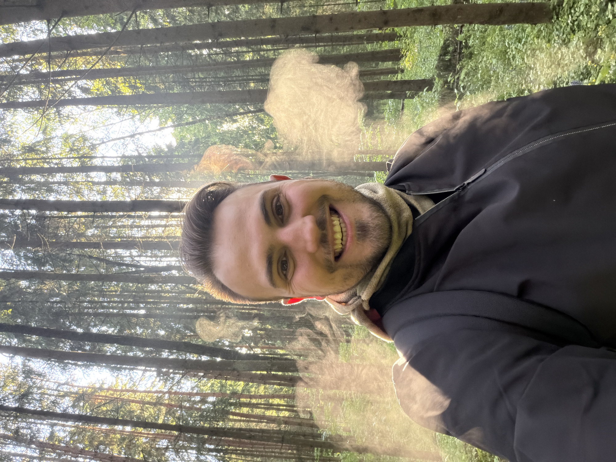 Man takes smiling selfie in Russian forest near Troitsk