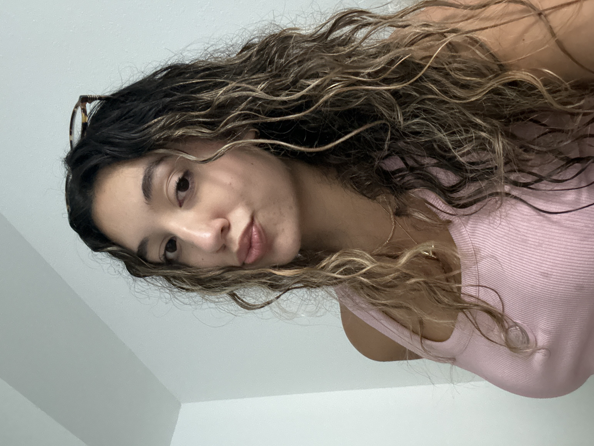 Portrait in Boca Raton, pink top and tortoiseshell frames